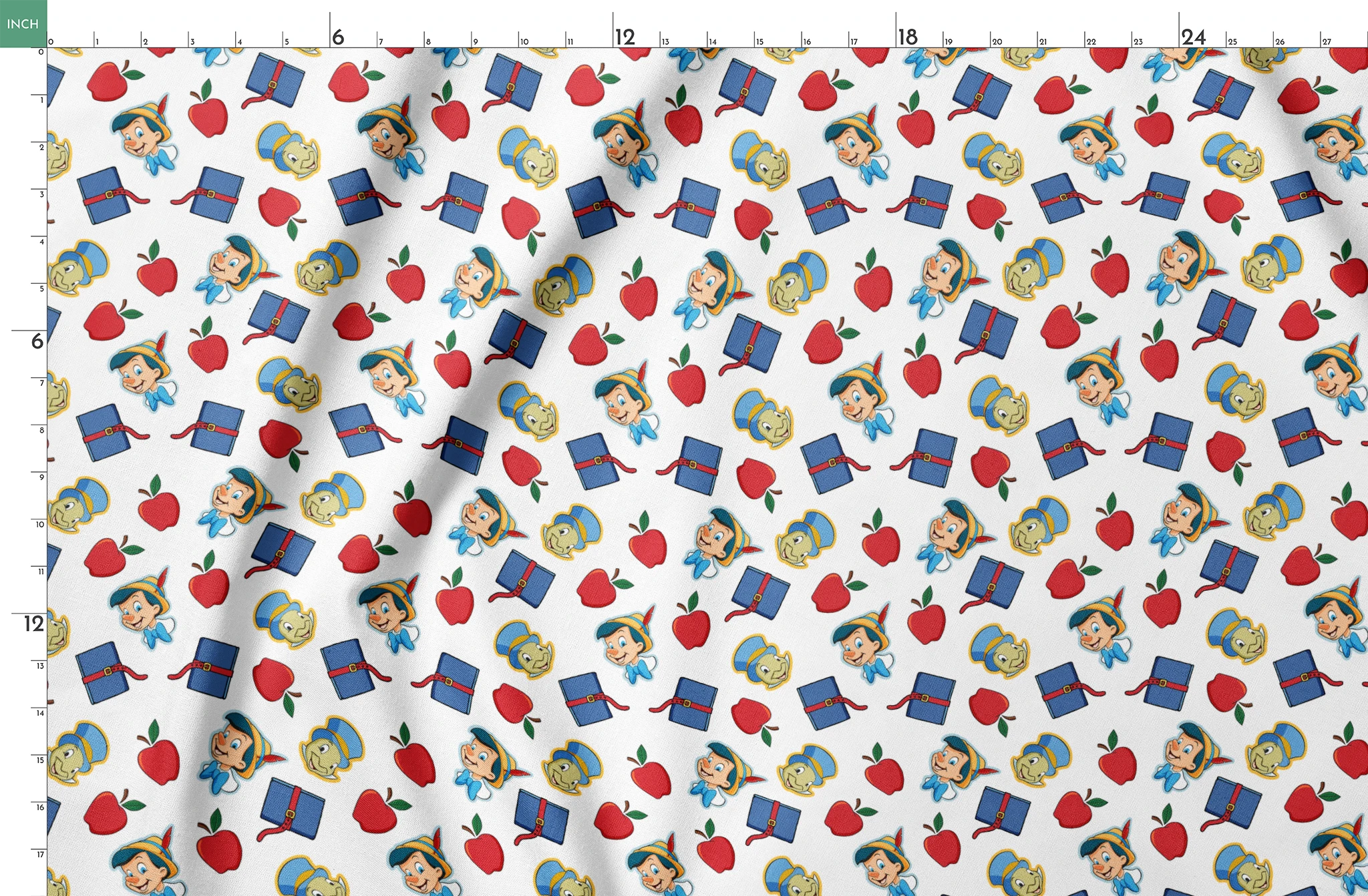 Pattern with cartoon character in pointed hat with blue bow, red apples, blue books with red straps, and yellow circular elements on white background springs fatquarter mockup