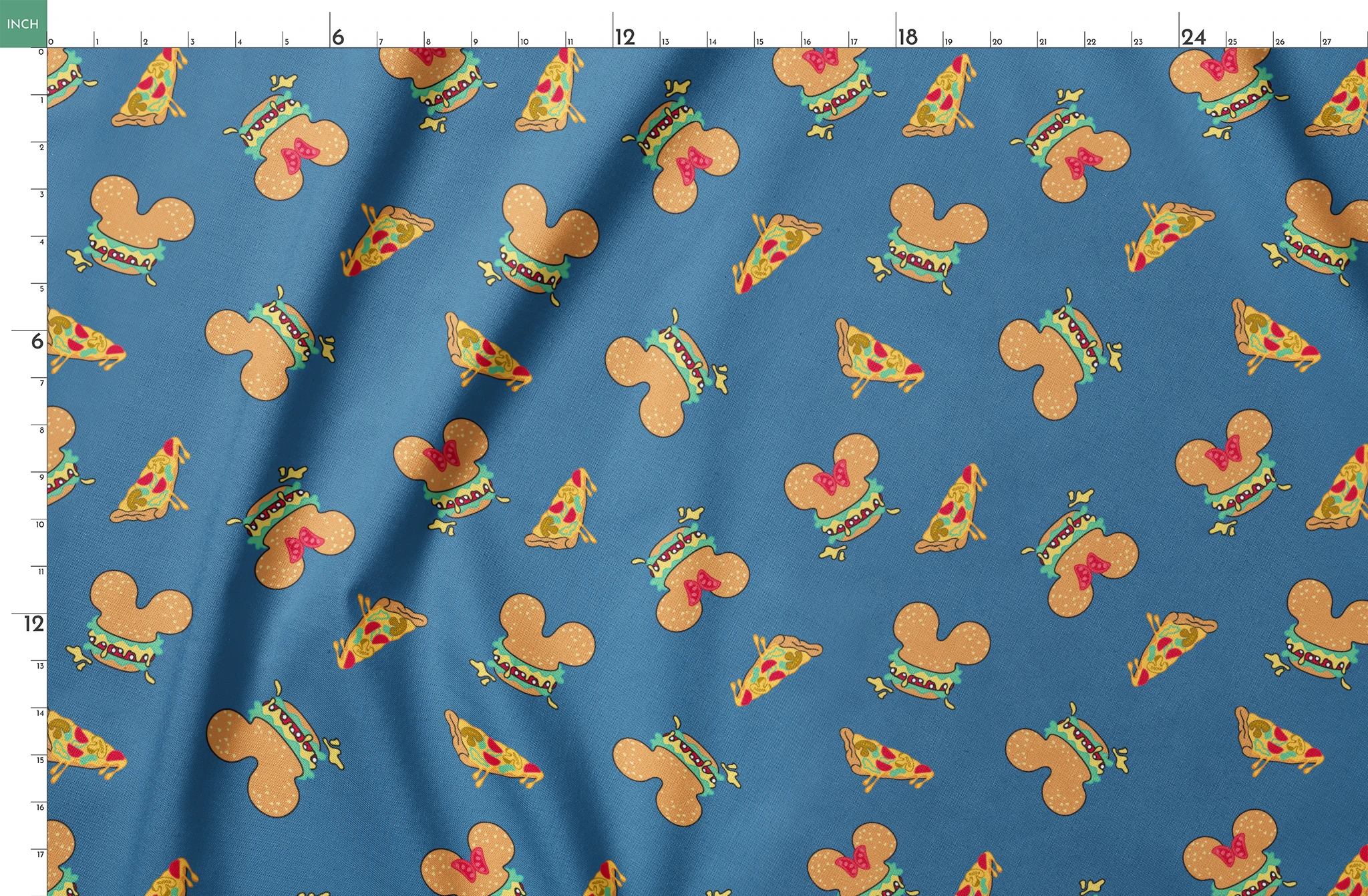 Pattern of Disney-inspired food items - hot dogs and pizza slices on blue background springs fatquarter mockup