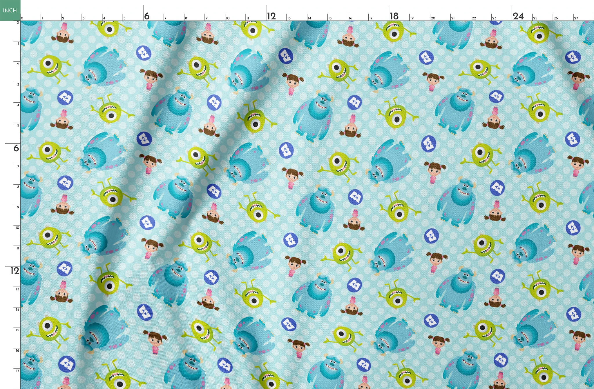 Cartoon Monsters Inc characters on light blue polka dot background springs fatquarter mockup
