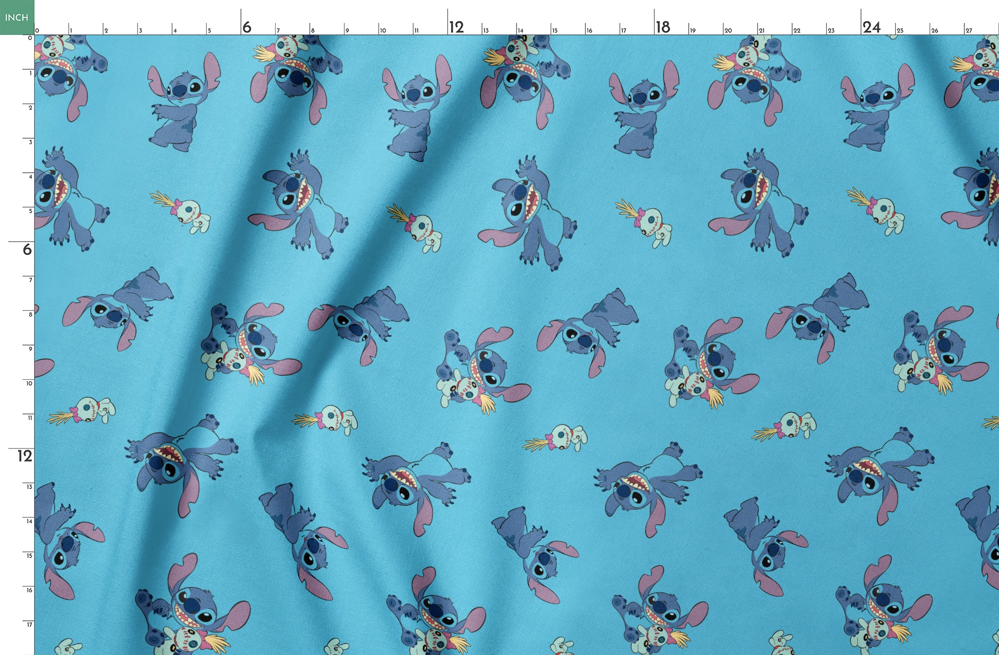Disney’s Stitch and Scrump in various playful poses scattered across a light blue background with small tropical flowers. springs fatquarter mockup