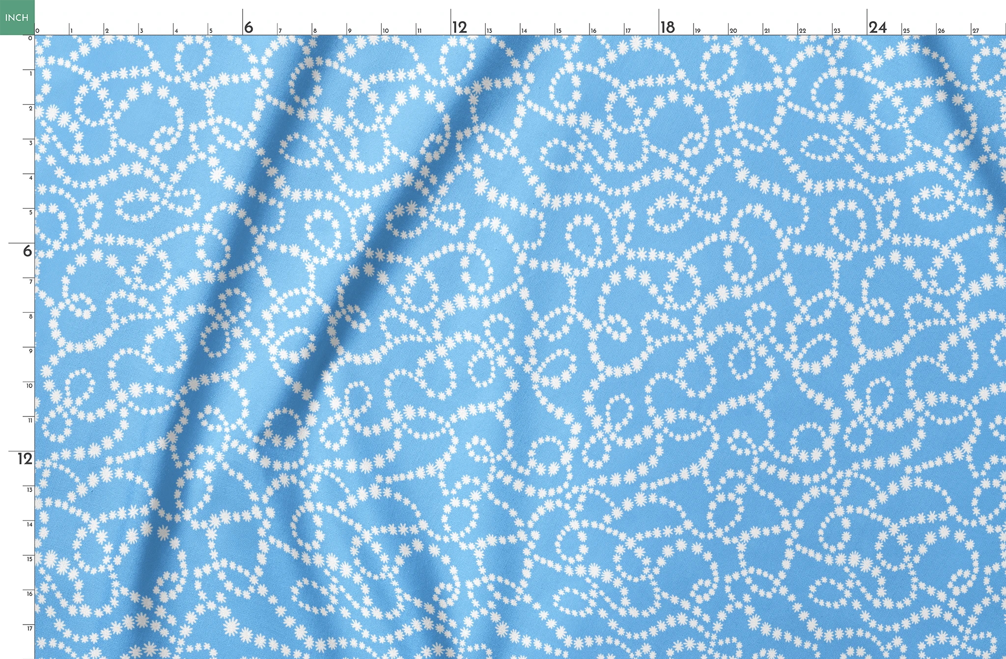 Sky blue background with swirling white dotted pattern resembling beaded strings or pearls arranged in curving lines springs fatquarter mockup