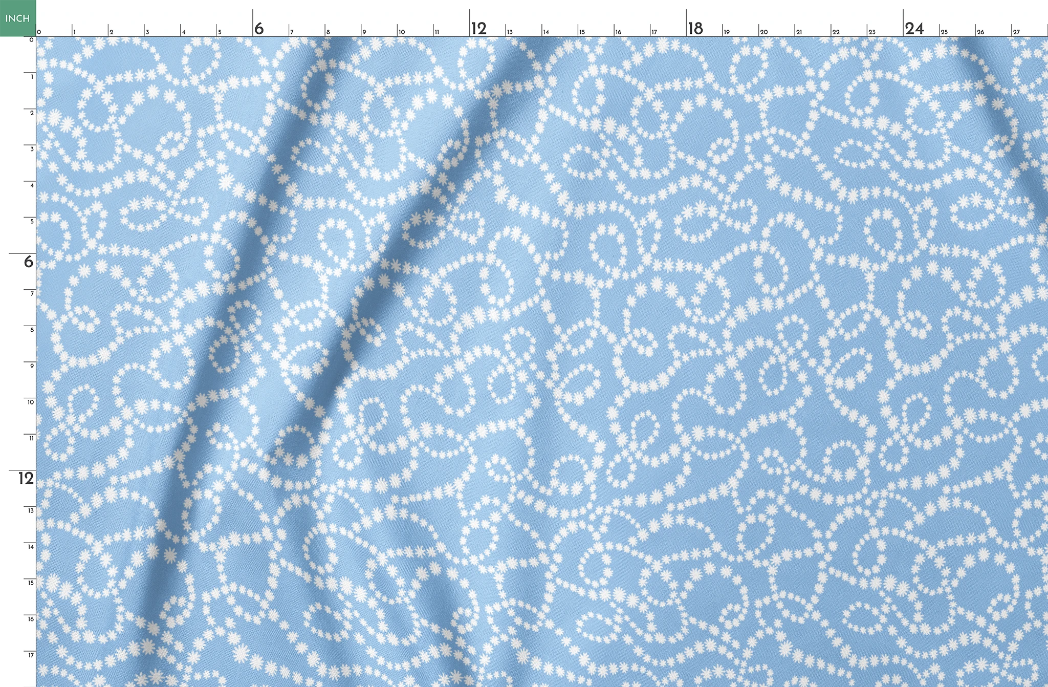 Pale blue background with white dotted swirling pattern resembling strings of pearls or bubbles in abstract curves springs fatquarter mockup