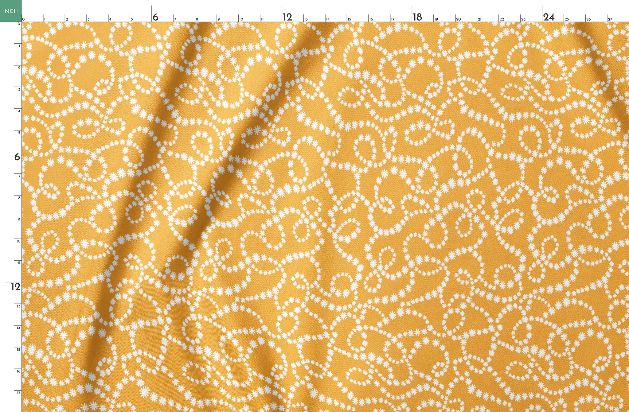 Mustard yellow background with swirling dotted white patterns forming organic circular designs springs fatquarter mockup