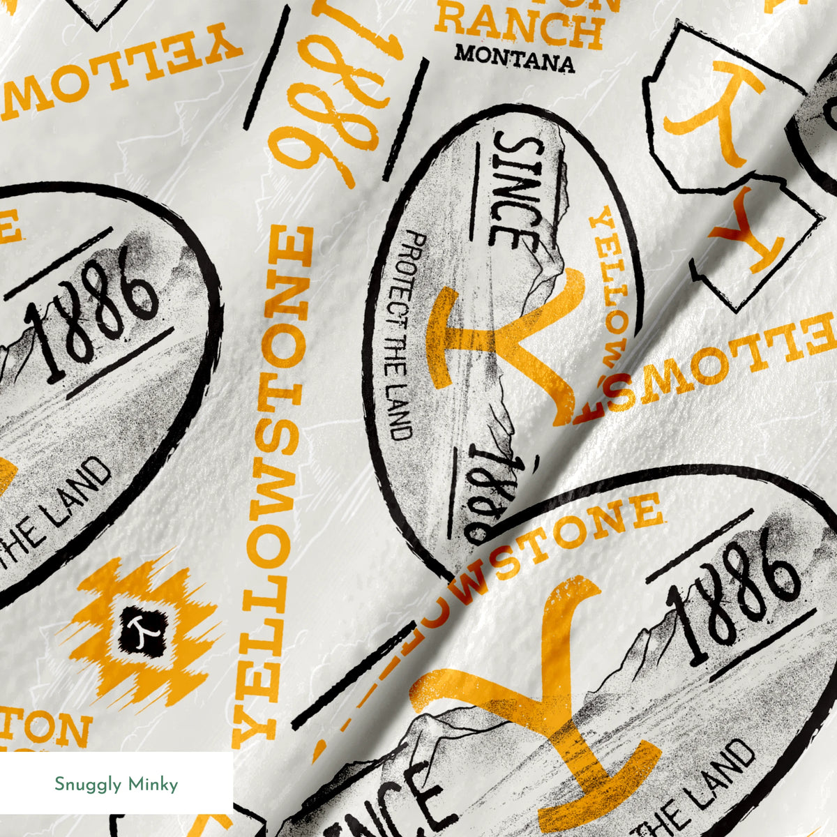 Yellowstone-themed design with black and gold badge graphics, “Protect the Land” text, and Dutton Ranch icons on a cream background. springs minky texture