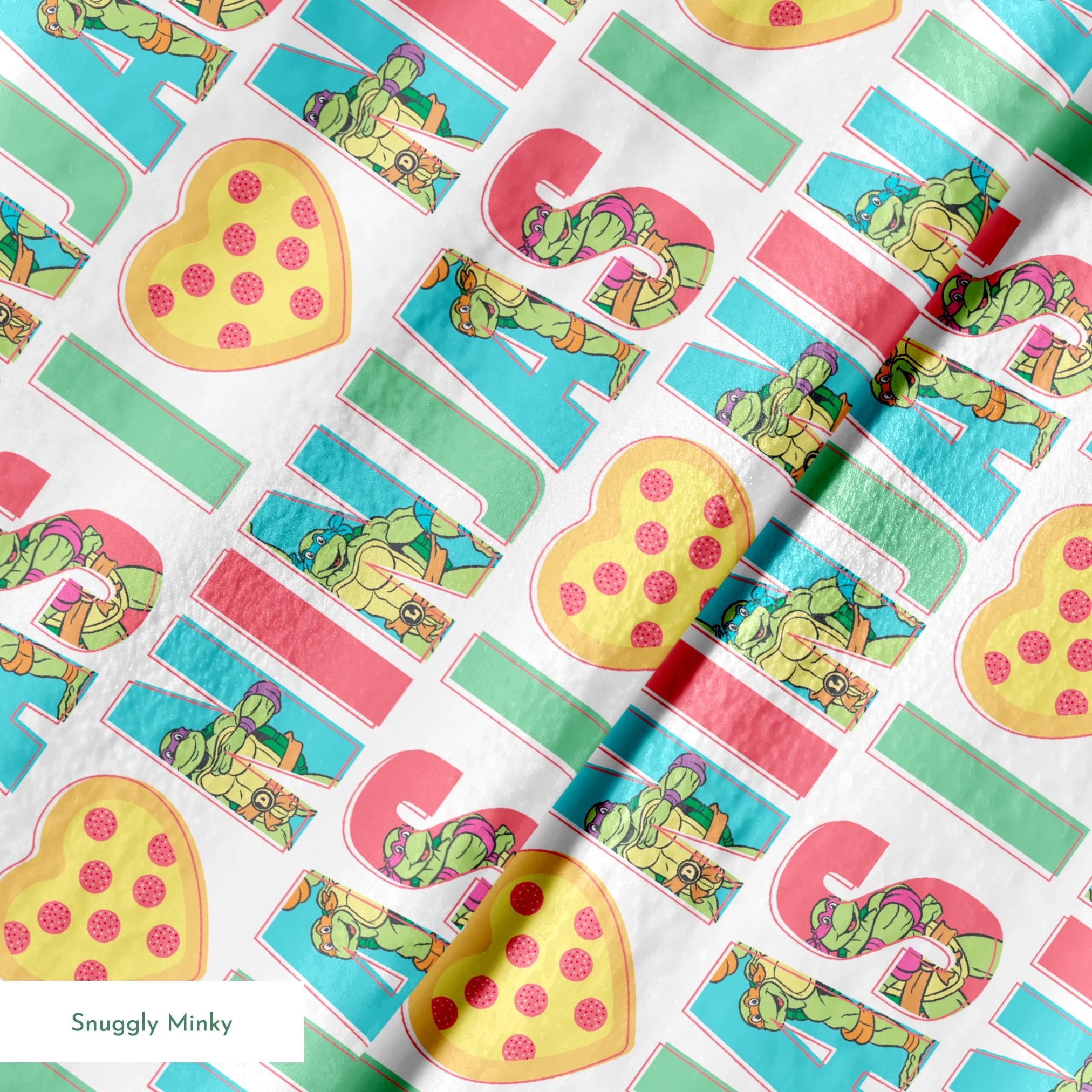 Teenage Mutant Ninja Turtles design with “I heart Ninjas” text with a pizza heart graphic, and Michelangelo and Leonardo in pastel colors. springs minky texture