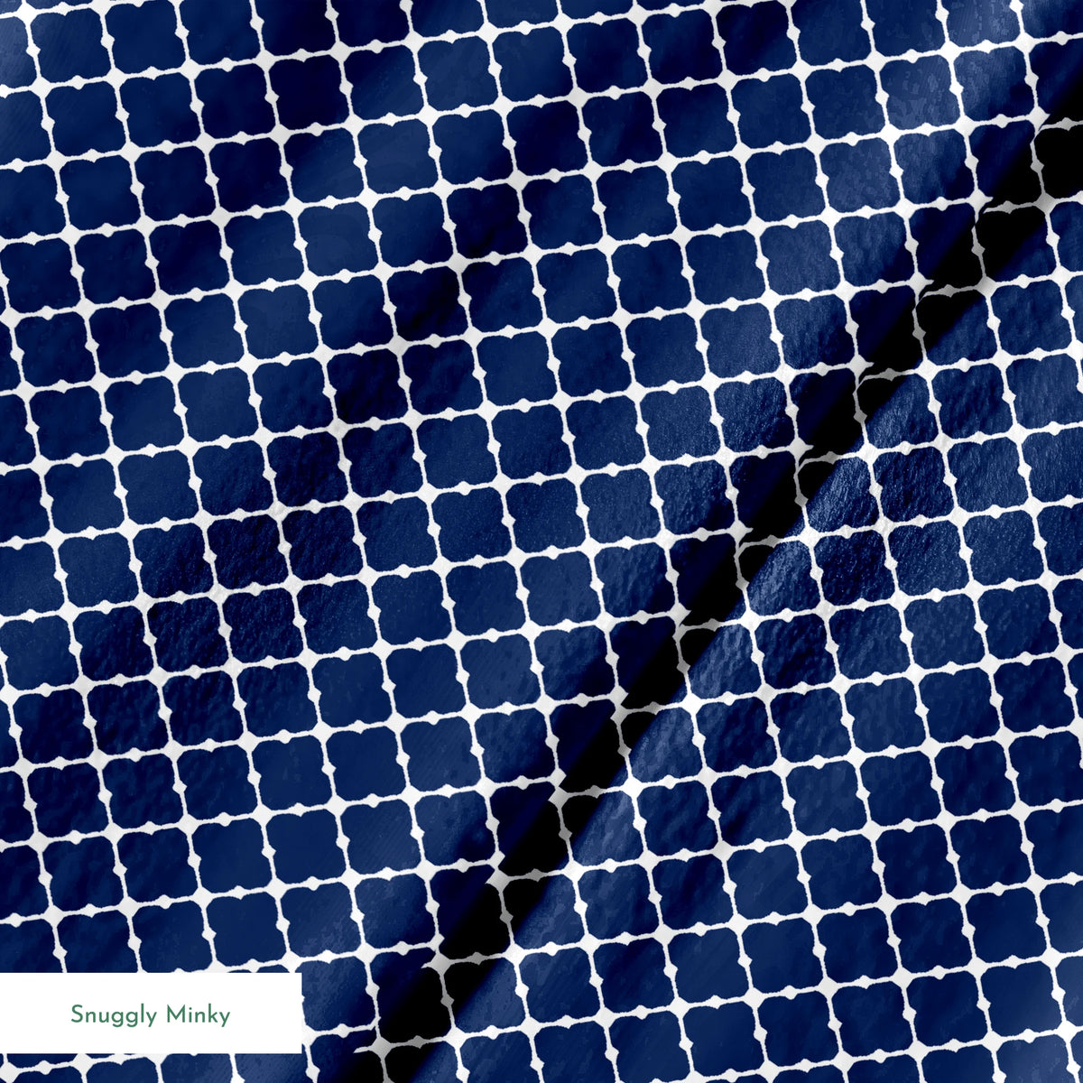 Navy blue quatrefoil pattern with white lattice design on dark background springs minky texture