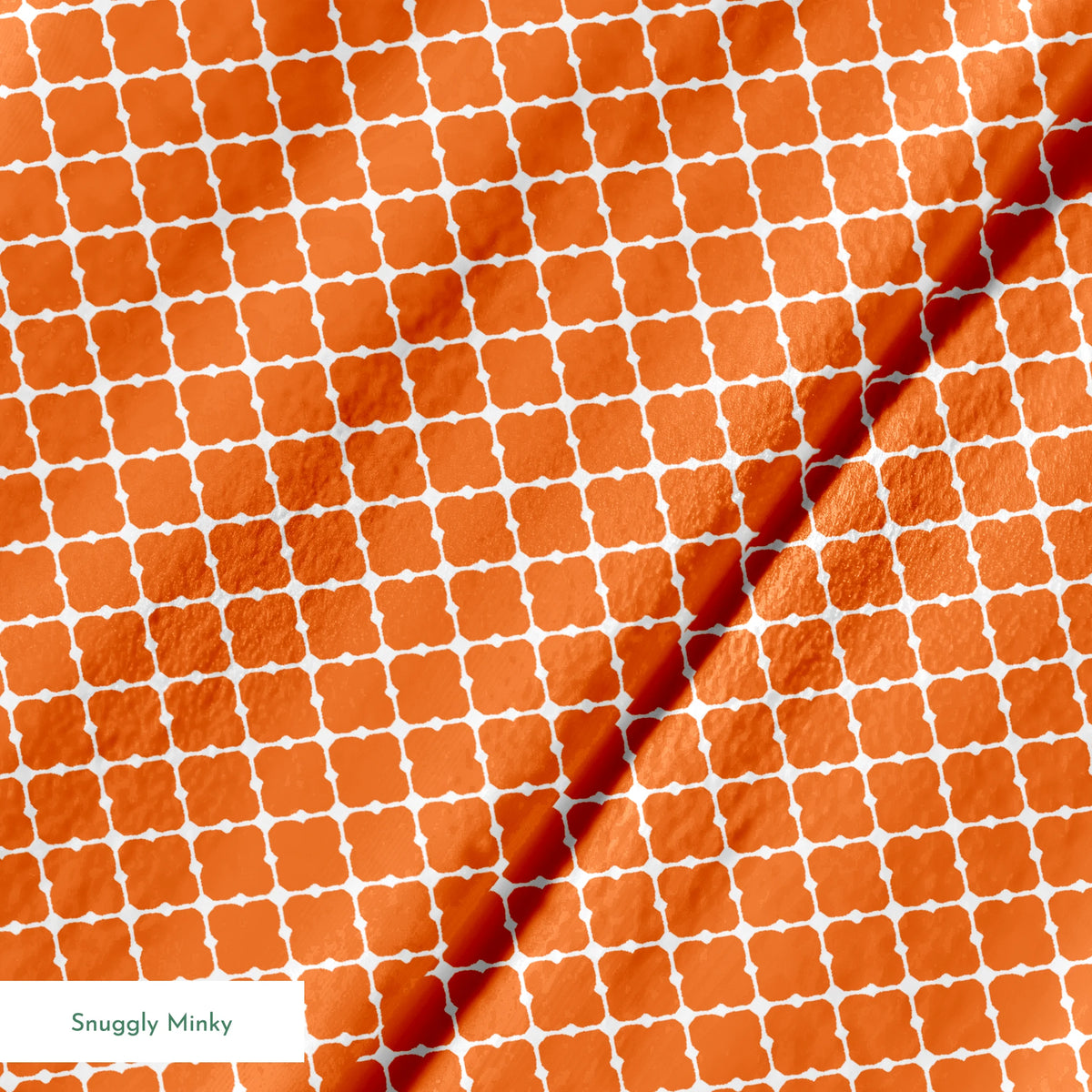 Burnt Orange and white quatrefoil pattern with smooth lattice design on orange background springs minky texture