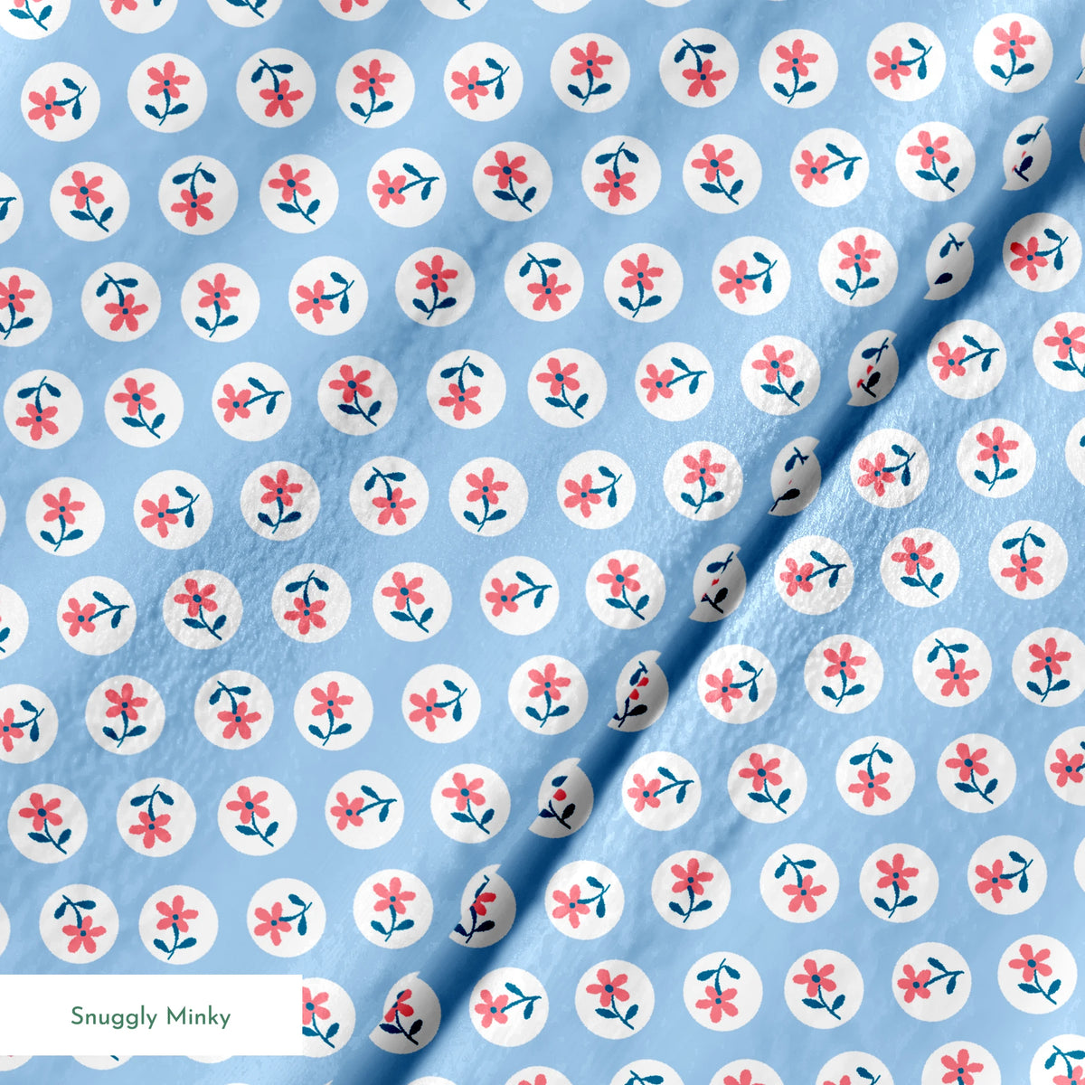 Pink flowers with blue-green stems in white circles on pale blue background, repeating pattern springs minky texture