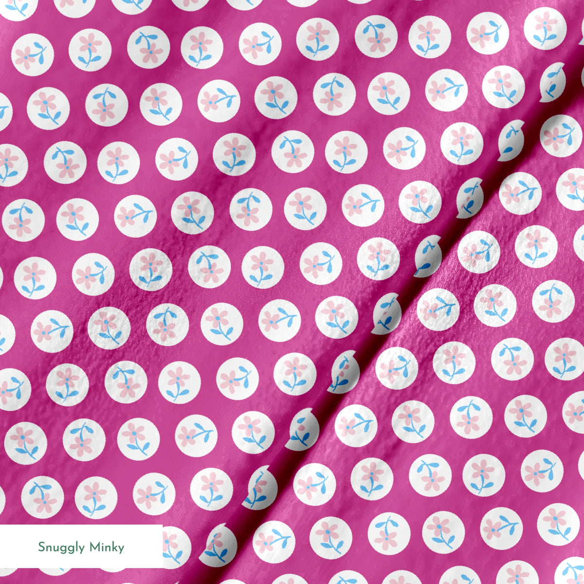 White circular dots with pink flowers and blue leaves pattern on vibrant magenta background springs minky texture