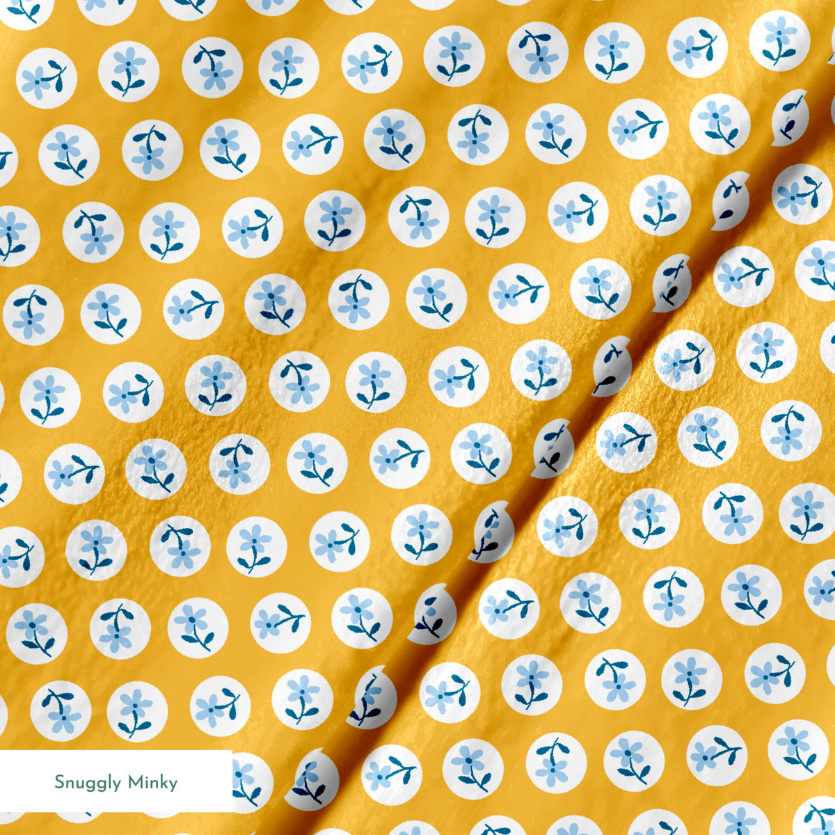Light blue flowers with navy stems in white circles on a mustard yellow background springs minky texture