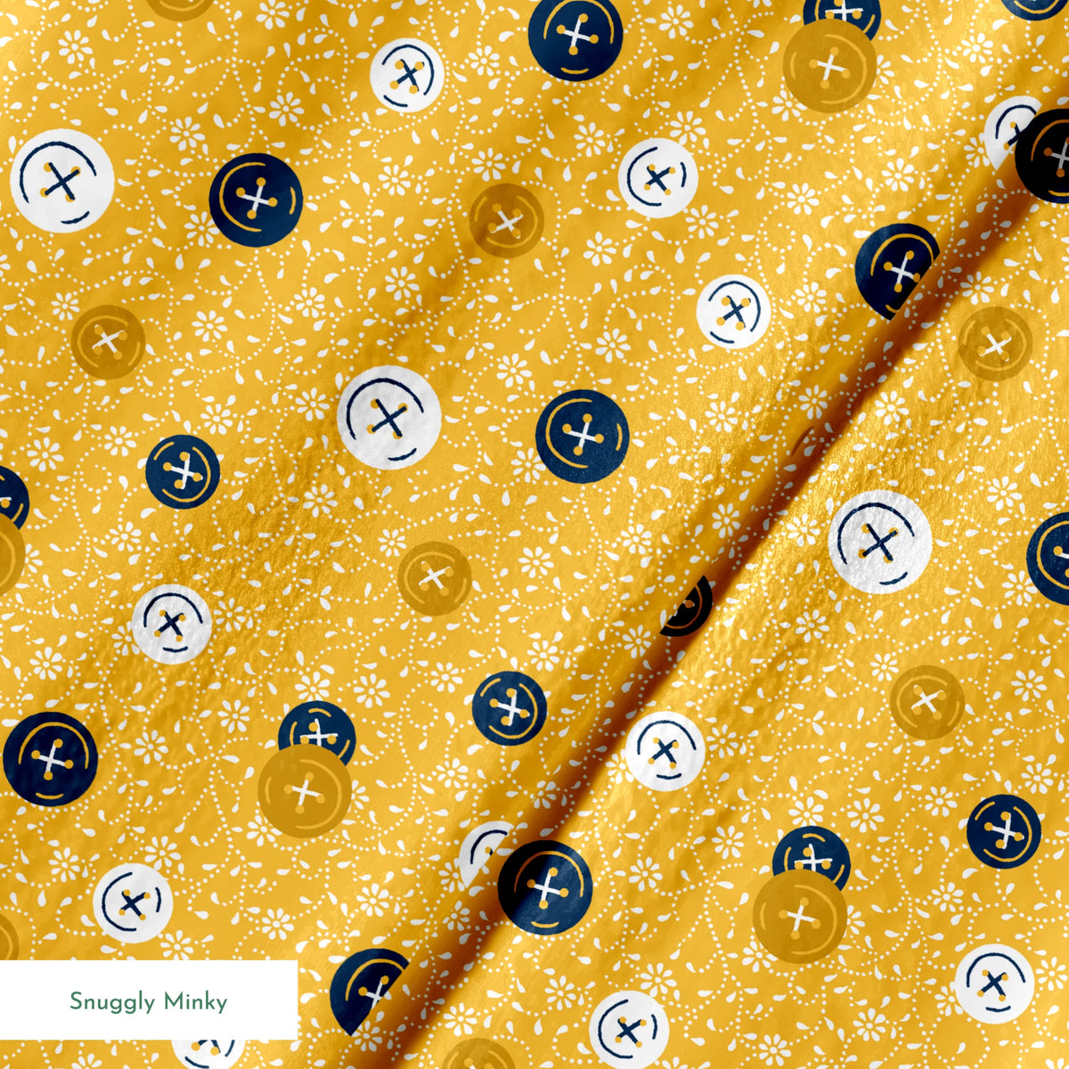 Circular buttons with cross symbols in gold, navy, and white scattered on a gold floral background springs minky texture