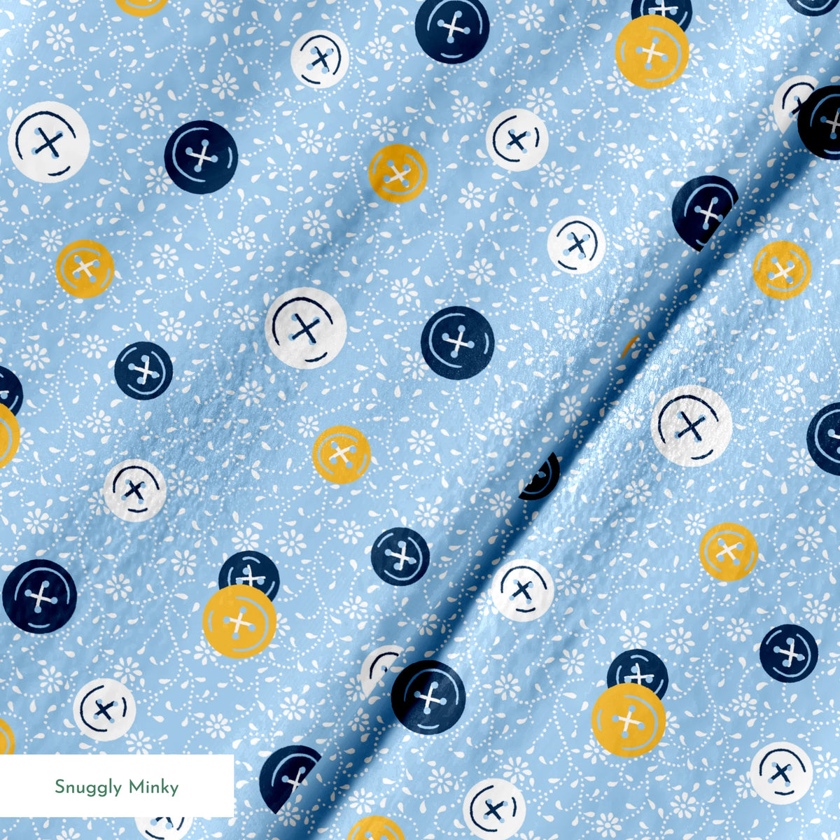 Blue background with scattered circular buttons in white, navy, and gold, each featuring cross designs, on a floral pattern. springs minky texture