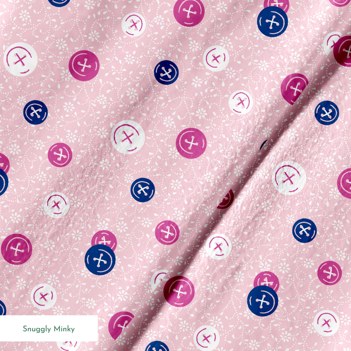 Scattered buttons in white, pink, and navy on a light pink floral background springs minky texture