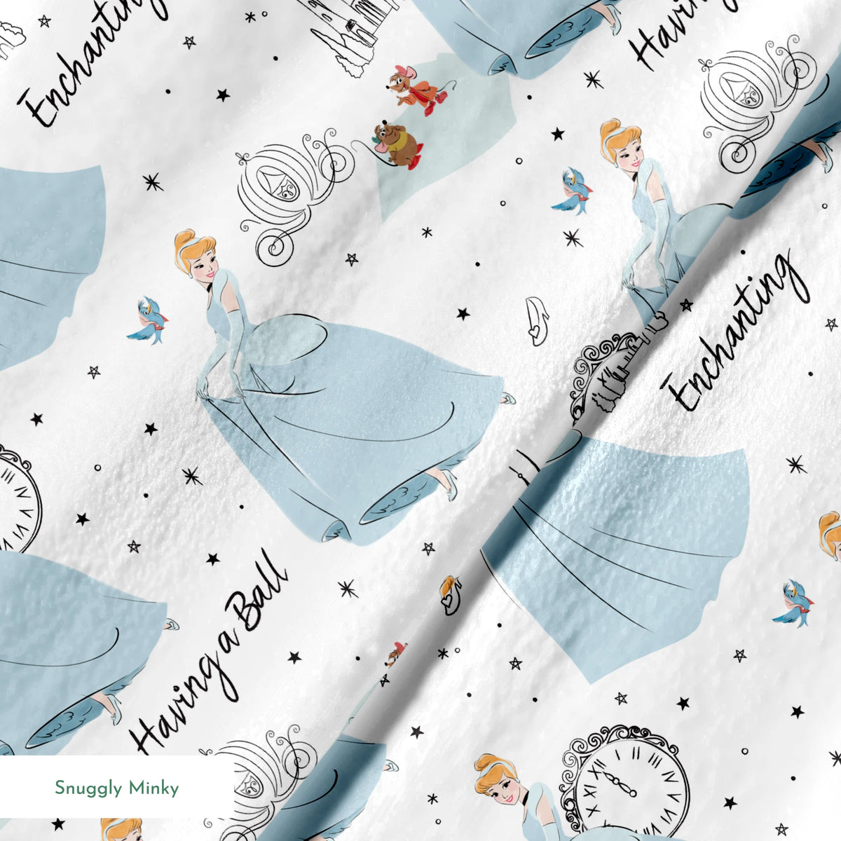 Whimsical pattern featuring cartoon princess in blue gown, clocks, castles, carriages and "Enchanting" text on white background springs minky texture