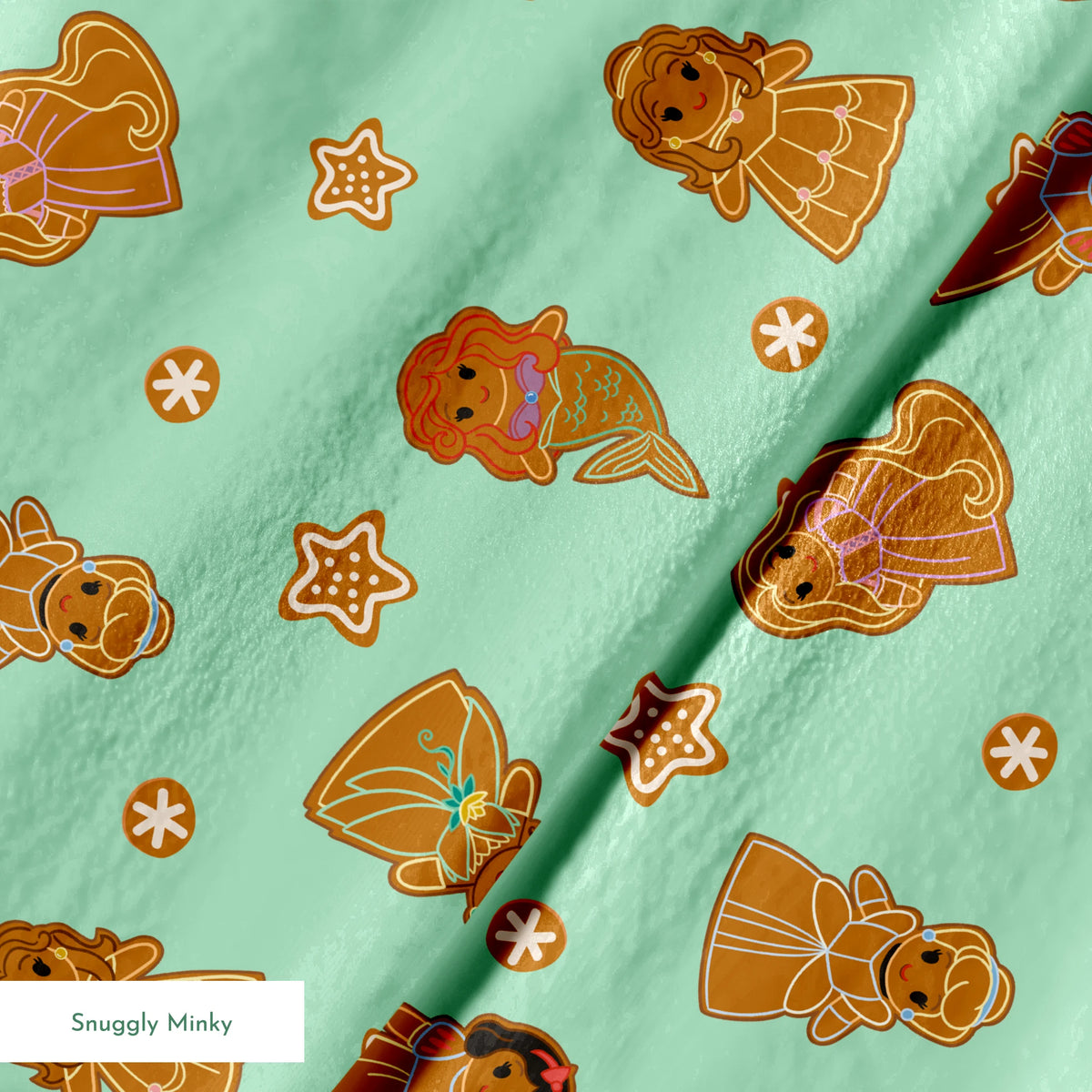 Disney Princess gingerbread cookies with star and snowflake designs on mint green background springs minky texture