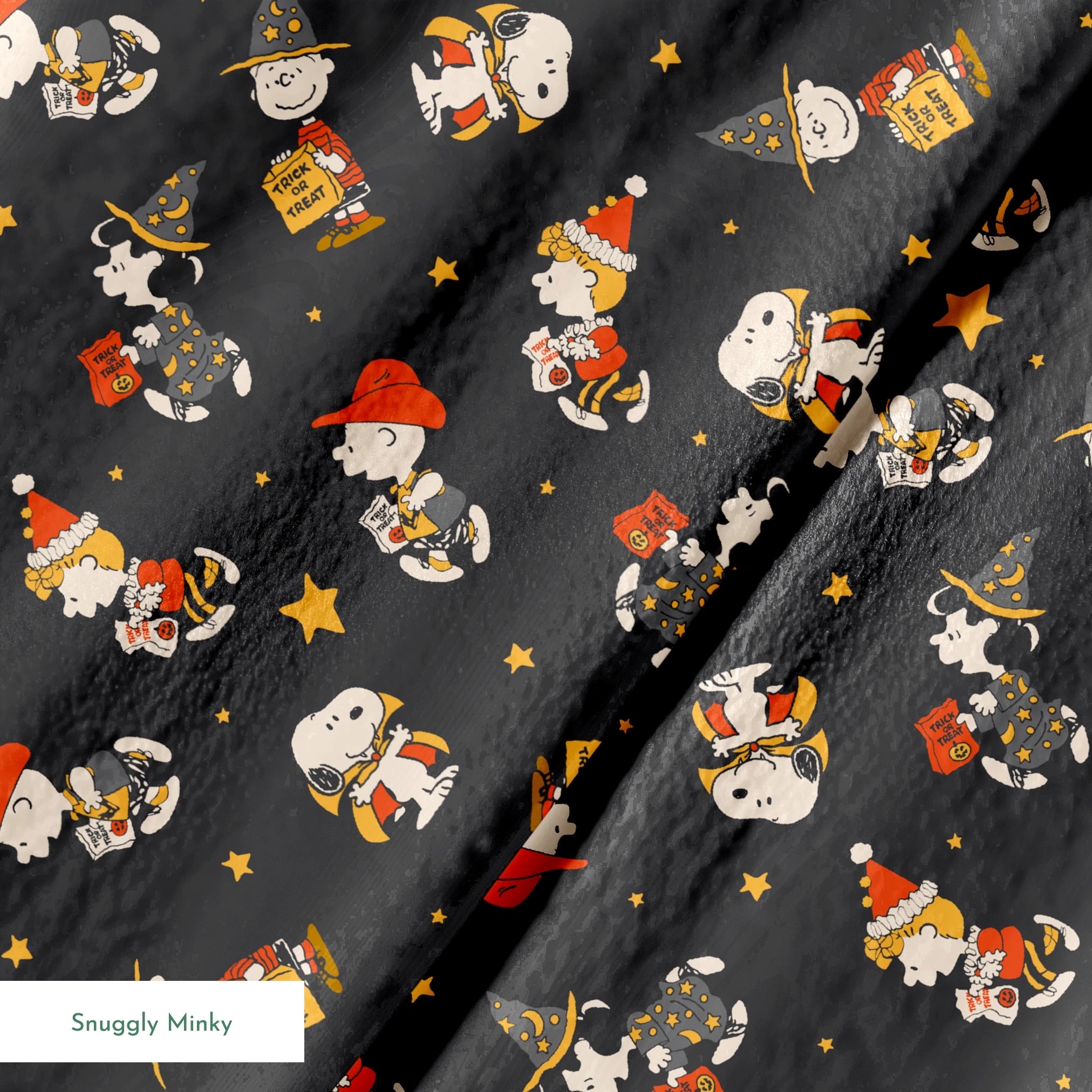 Snoopy cartoon pattern on dark gray background with characters in Halloween costumes and golden stars springs minky texture
