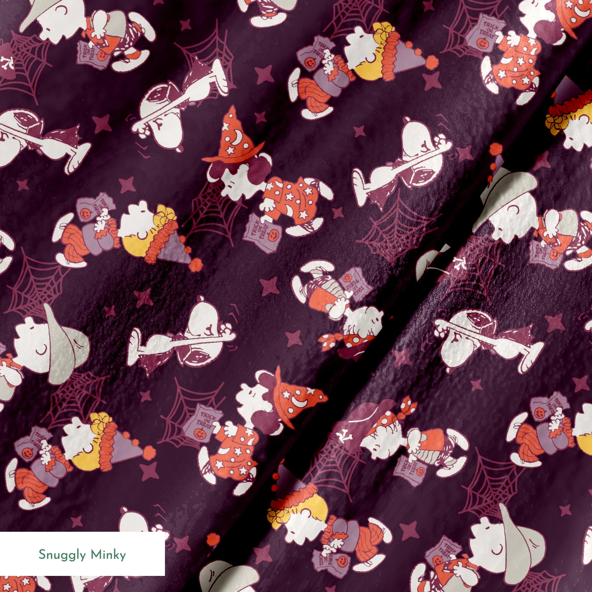 Snoopy and Peanuts characters in Halloween costumes scattered on dark purple background springs minky texture