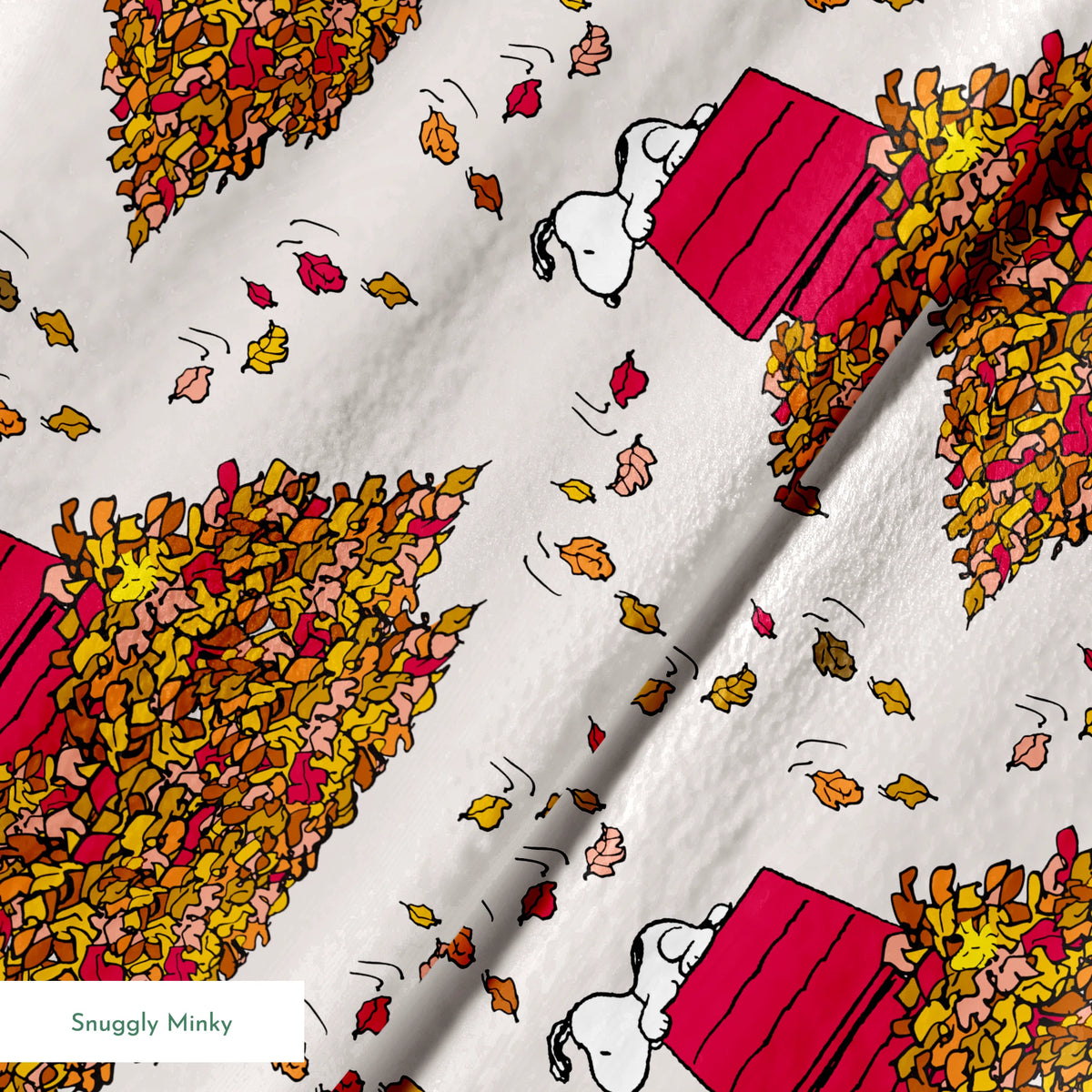 Snoopy and red doghouse on colorful autumn leaf piles with falling leaves pattern on beige background springs minky texture
