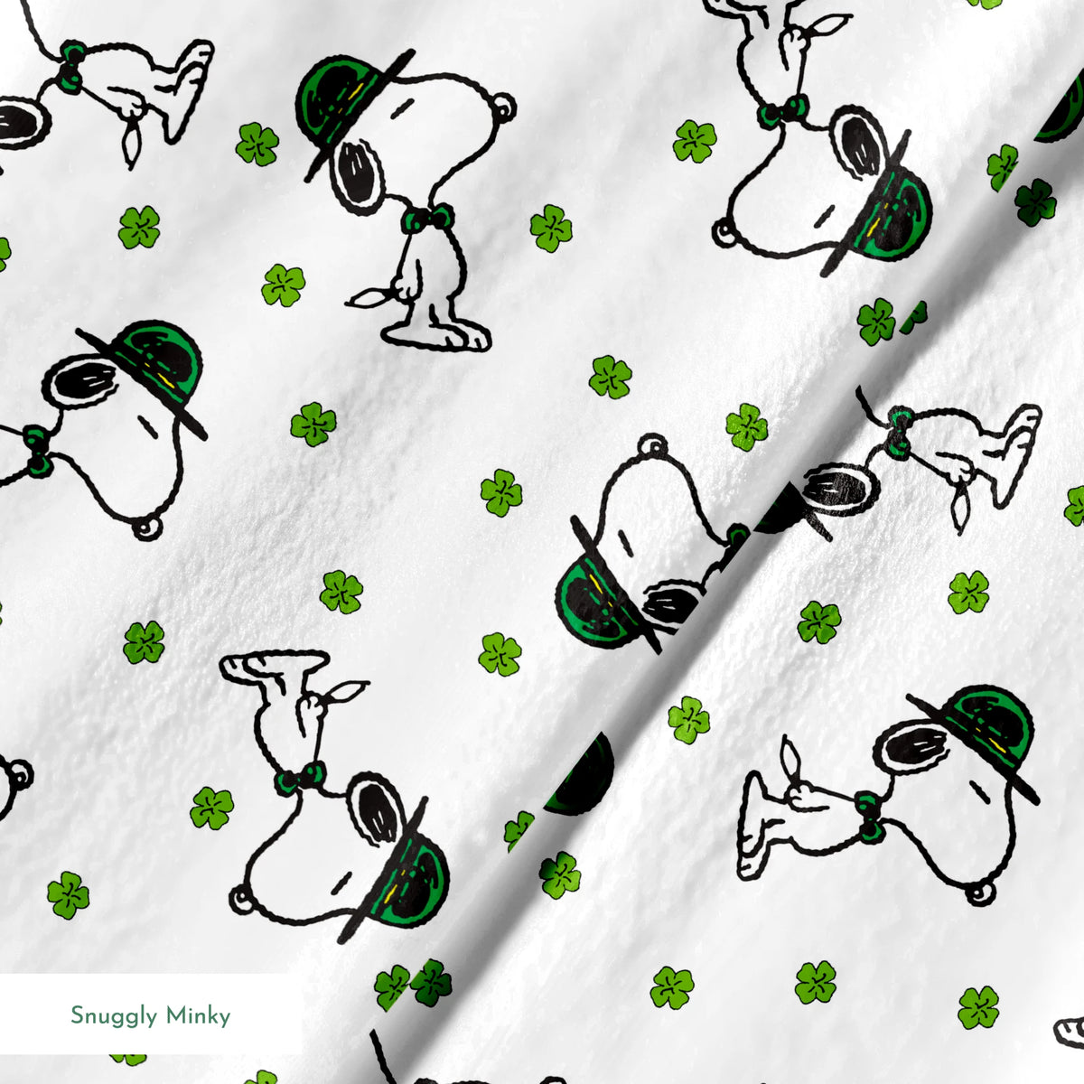Cartoon Snoopy wearing green hat with shamrocks scattered across white background springs minky texture