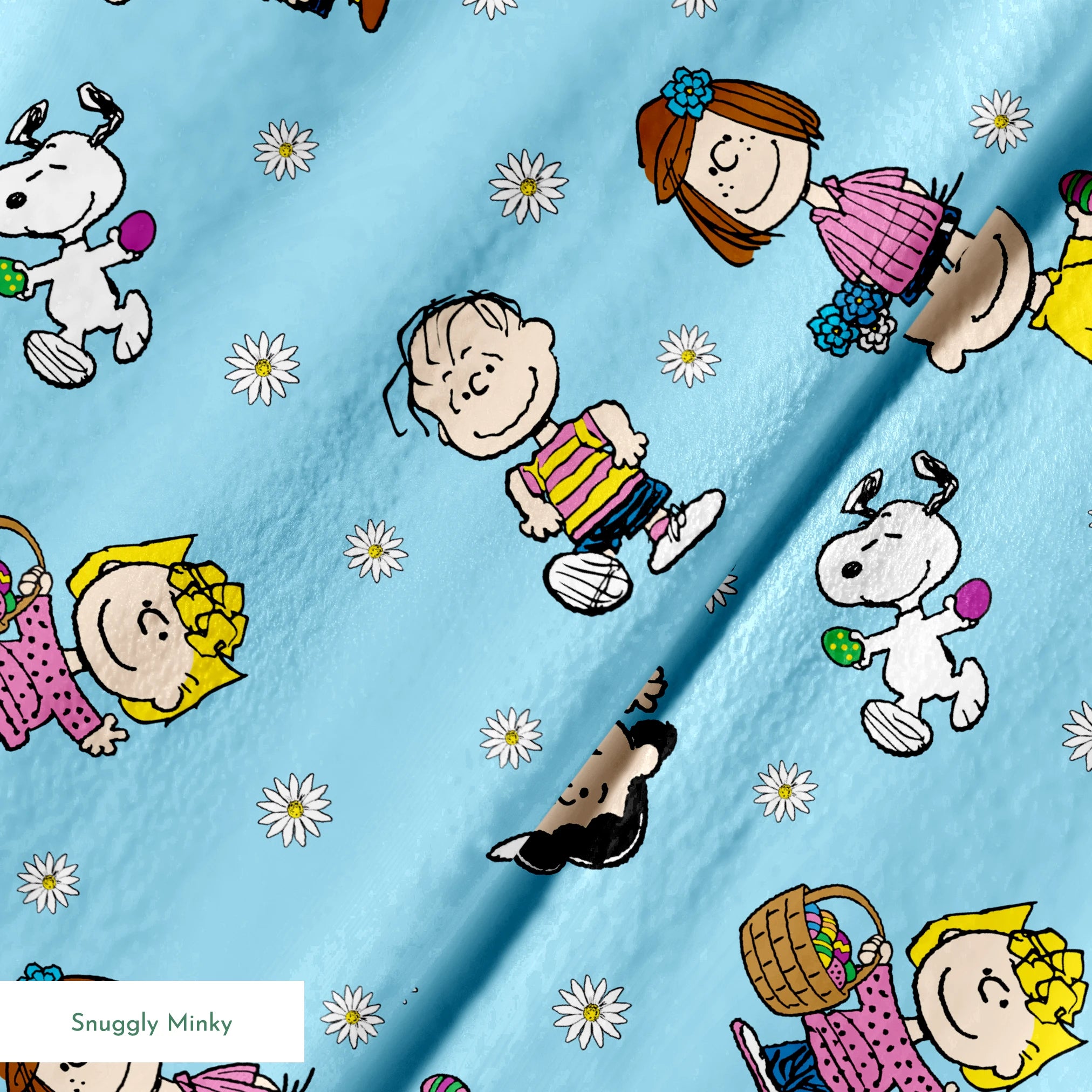 Peanuts cartoon characters scattered on light blue background with white daisies pattern springs minky texture