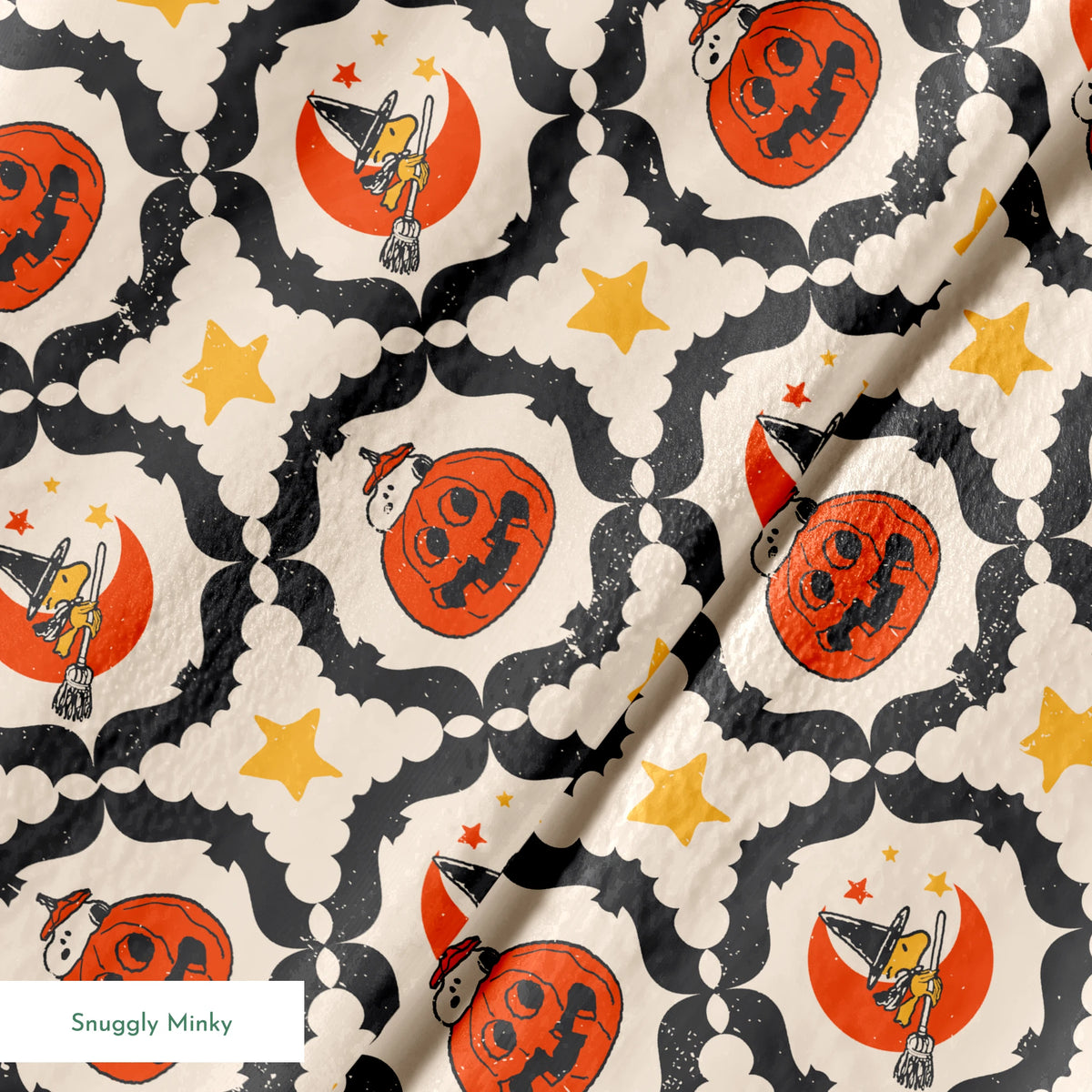 Peanuts Halloween pattern with orange jack-o'-lanterns, crescent moons with witch hats, yellow stars, and black bat borders on cream background springs minky texture