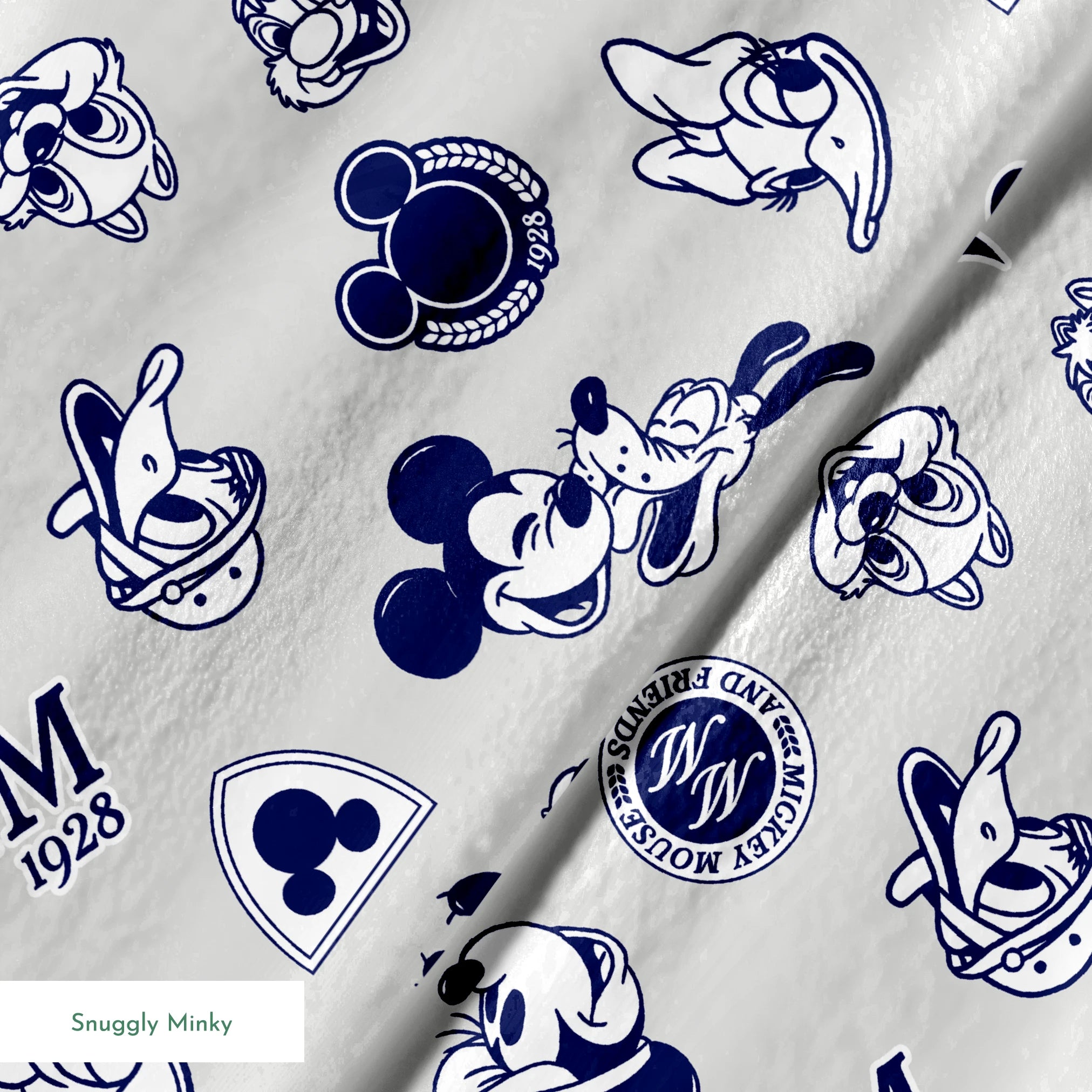 Disney character pattern with Mickey Mouse, Donald Duck and other classic cartoon figures in navy blue on light background. springs minky texture