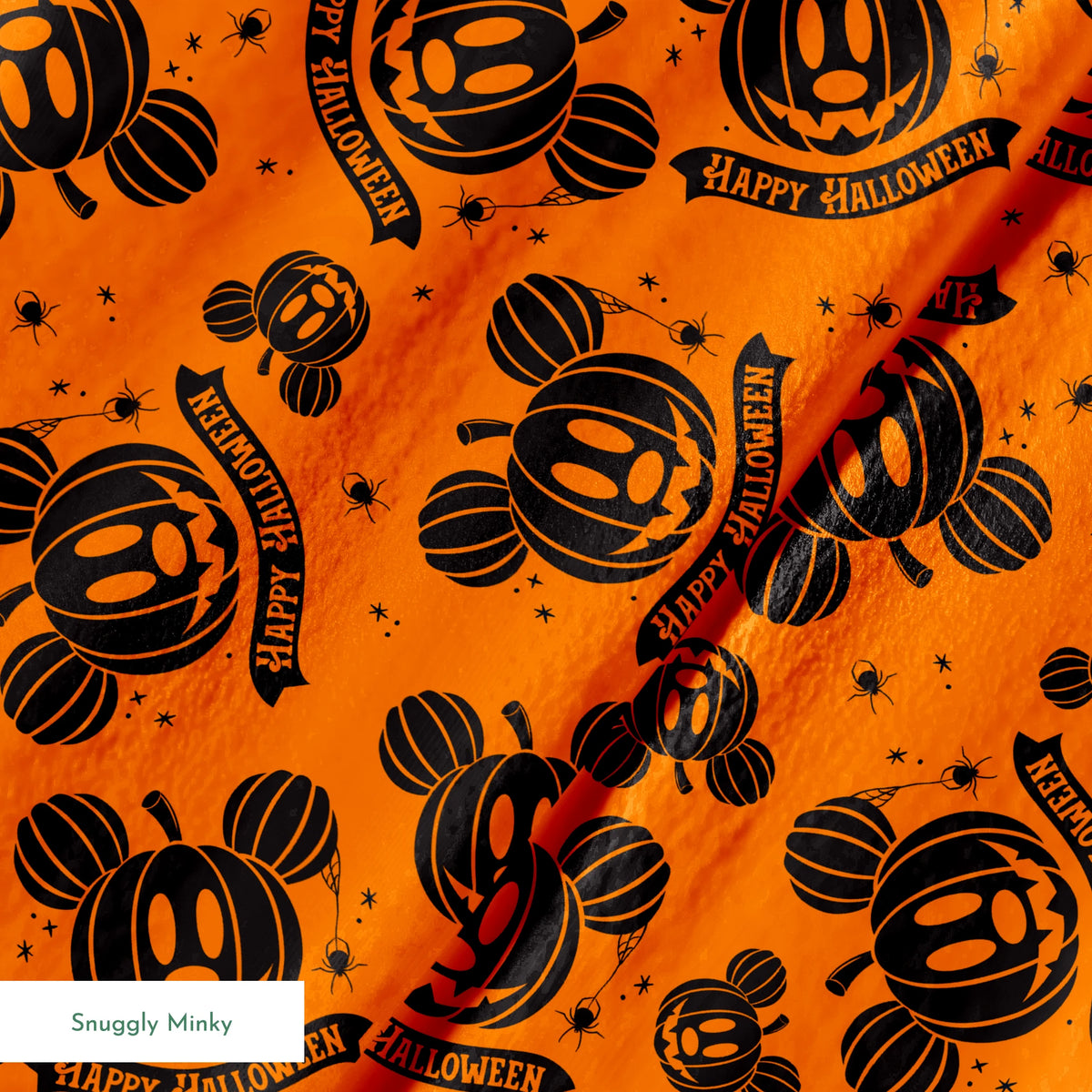 Halloween pattern with Disney-inspired jack-o'-lantern pumpkins and "Happy Halloween" text on bright orange background springs minky texture
