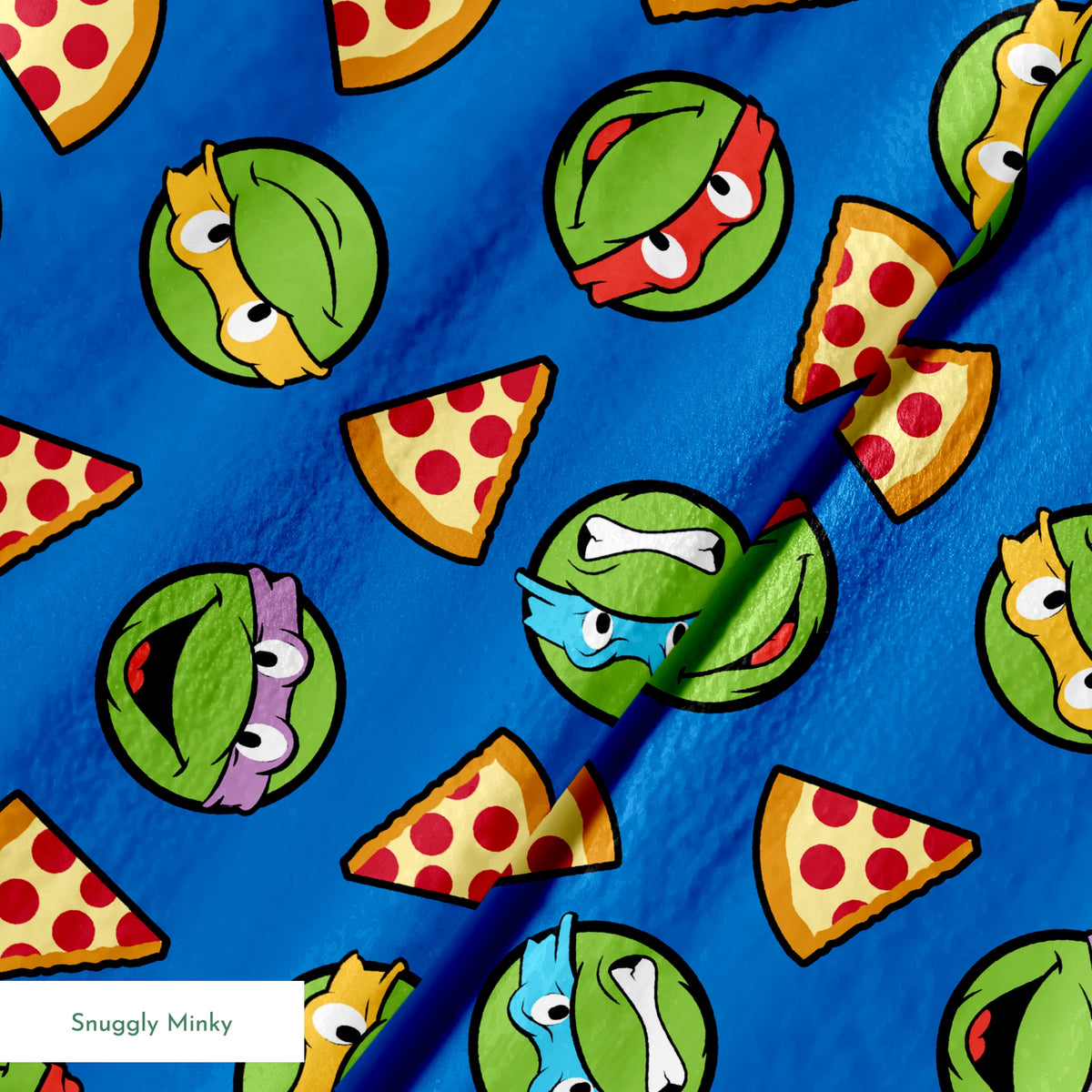 Teenage Mutant Ninja Turtle faces with colored masks and pizza slices pattern on blue background springs minky texture