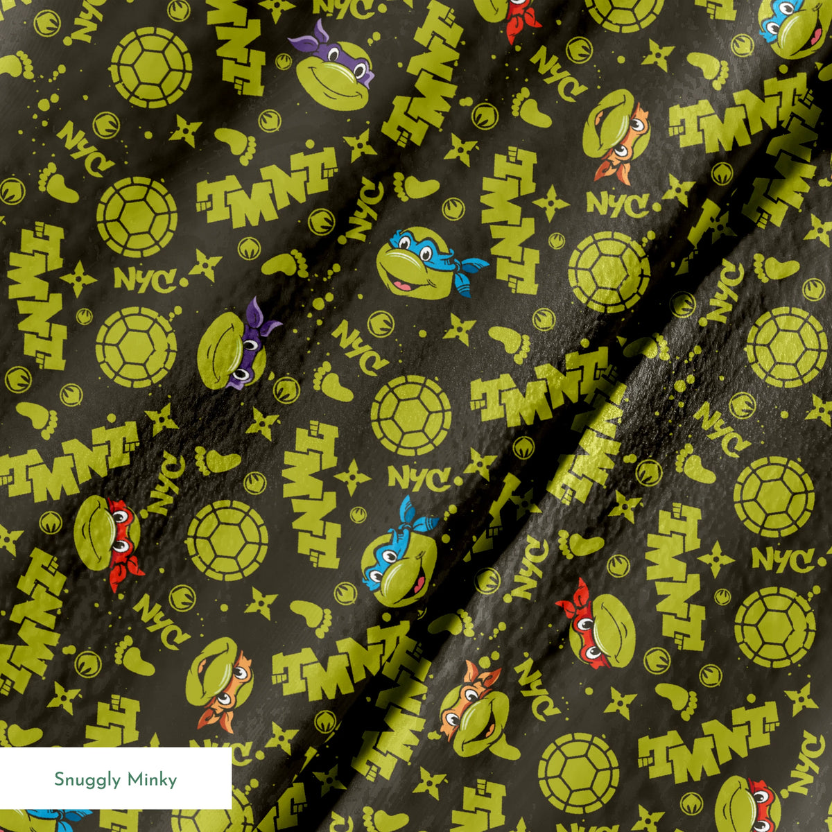 Pattern of Teenage Mutant Ninja Turtles with "TMNT" text on dark background springs minky texture
