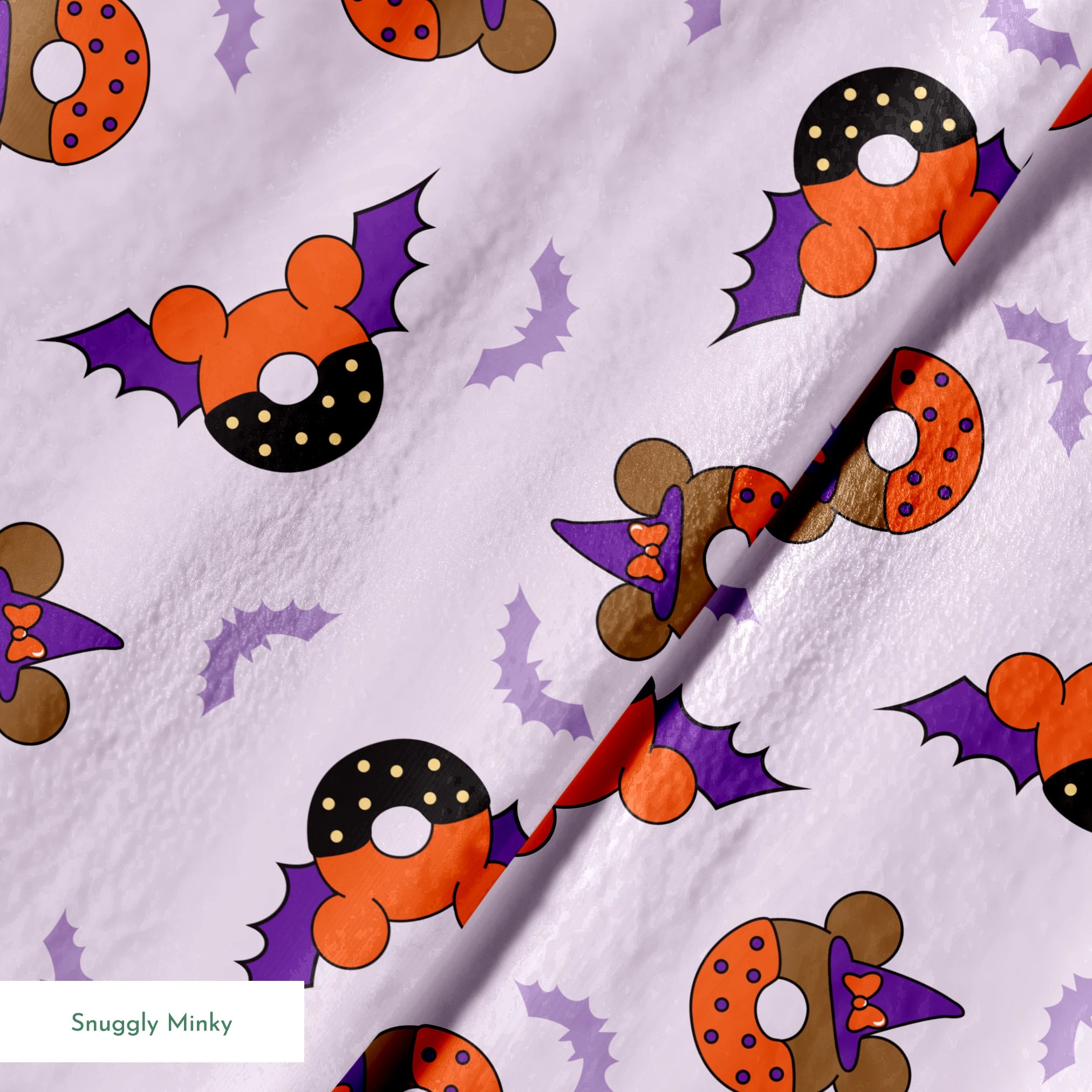 Disney Halloween-themed pattern with orange and black donuts, purple bat wings, and light purple bats on lavender background springs minky texture