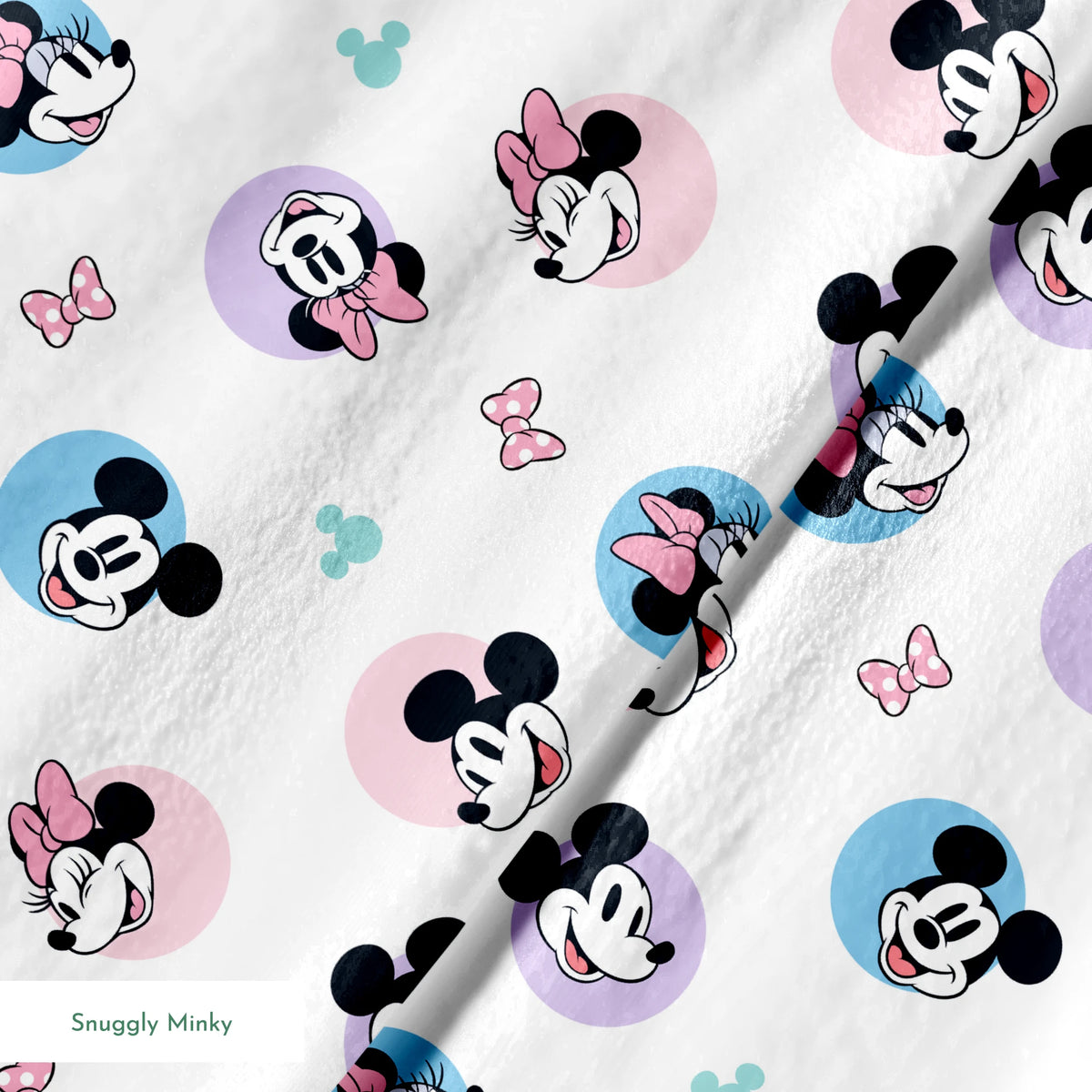 Disney Mickey and Minnie Mouse pattern with character heads on pastel circles, pink bows, and small Mickey icons springs minky texture