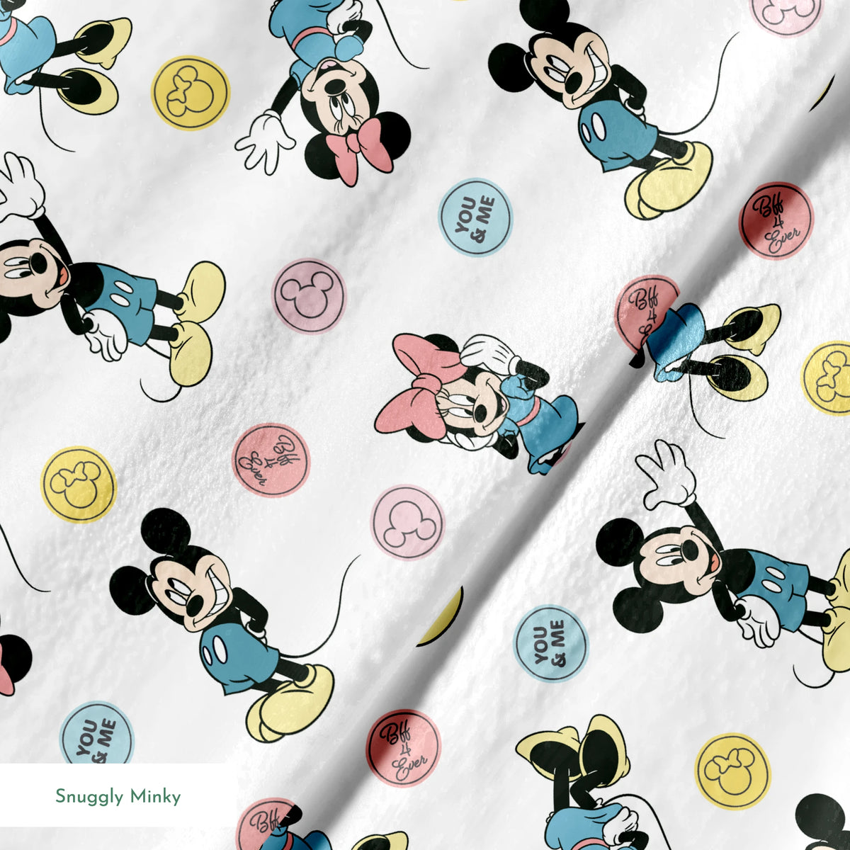 Mickey Mouse and Minnie Mouse cartoon pattern with colorful circles containing phrases on white background. springs minky texture