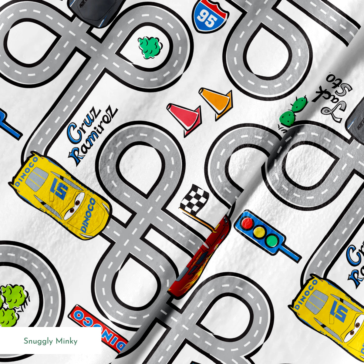 Cartoon road map with cars, traffic signs, and "Cruz Ramirez" label on winding gray streets springs minky texture