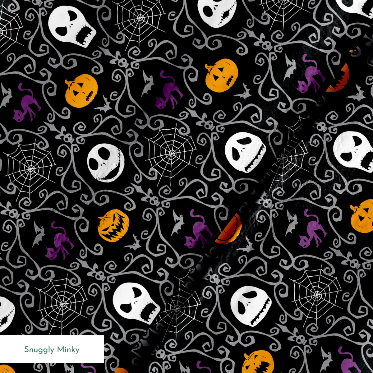 Nightmare Before Christmas pattern with skulls, pumpkins, bats and ornate swirls on black background springs minky texture
