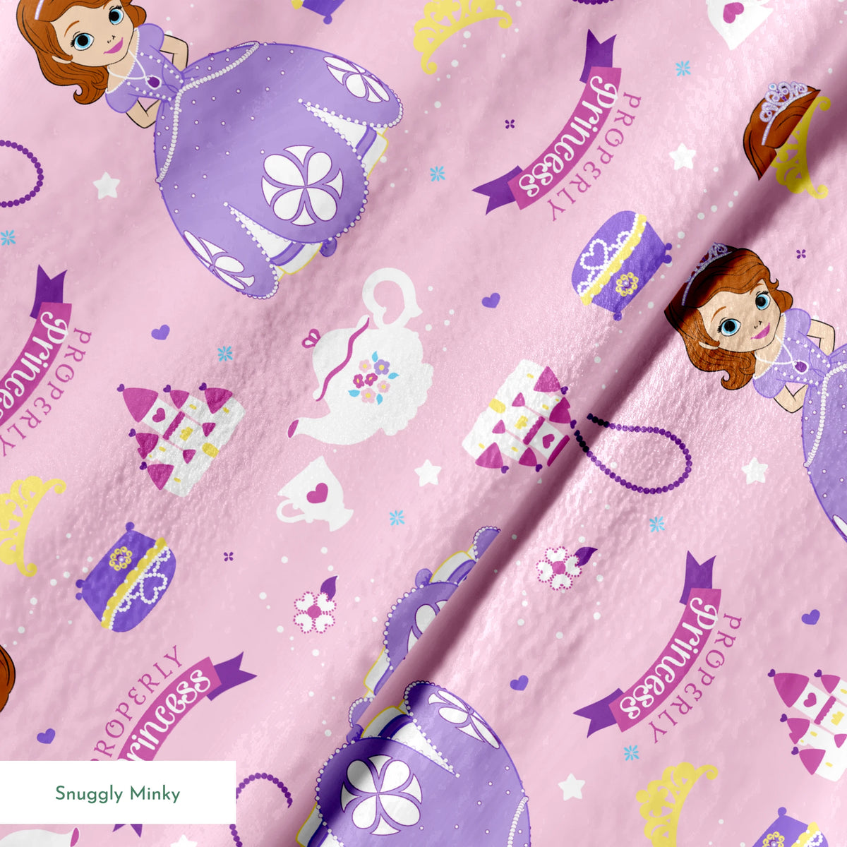 Princess-themed pattern with purple dresses, tiaras, teapots, and banners on pink background springs minky texture