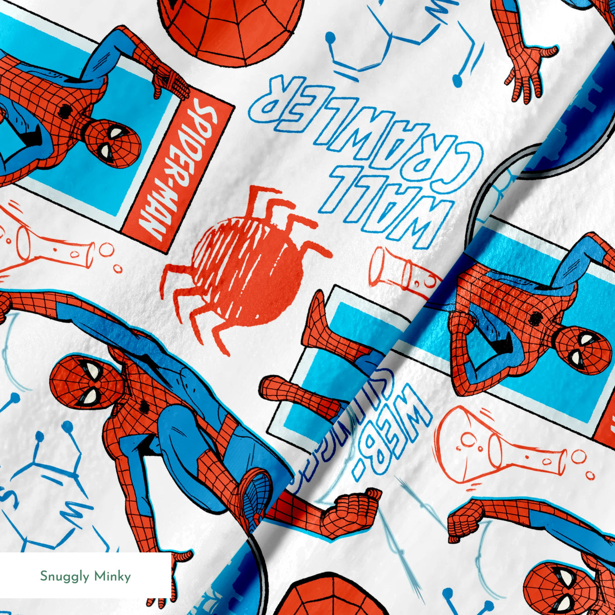 Comic-style Spider-Man pattern with red and blue figures in various poses, spider symbols, and text on white background springs minky texture