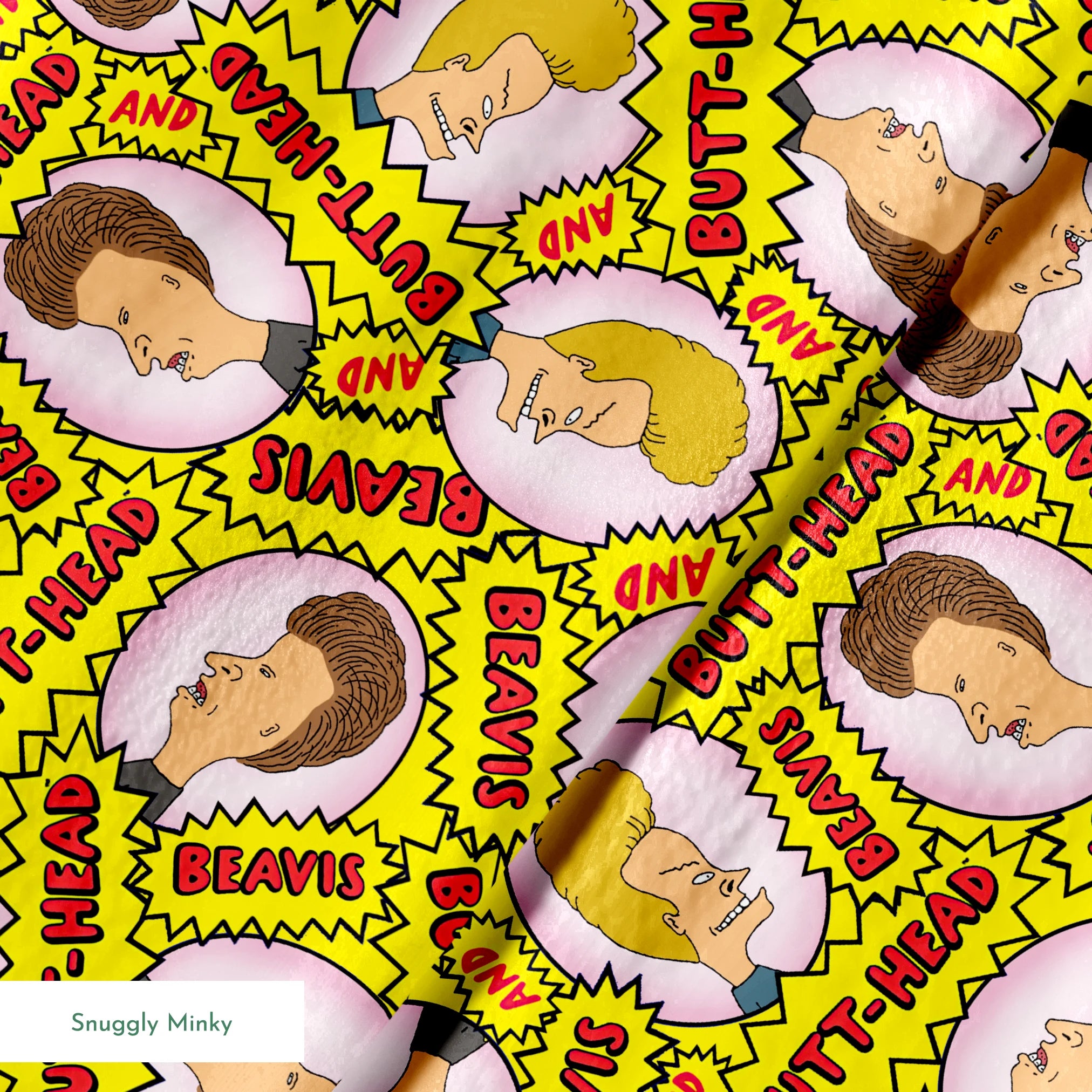 Yellow pattern with cartoon characters and text "BEAVIS" and "BUTT-HEAD" in comic-style speech bubbles repeated throughout springs minky texture