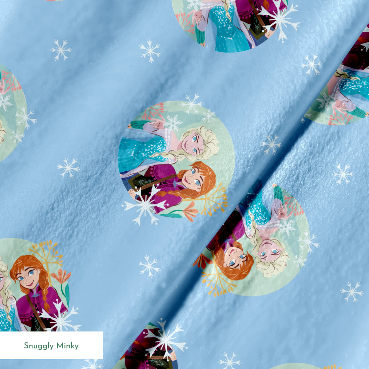 Light blue background with repeating circular motifs of "Frozen" characters and snowflakes in a decorative pattern springs minky texture