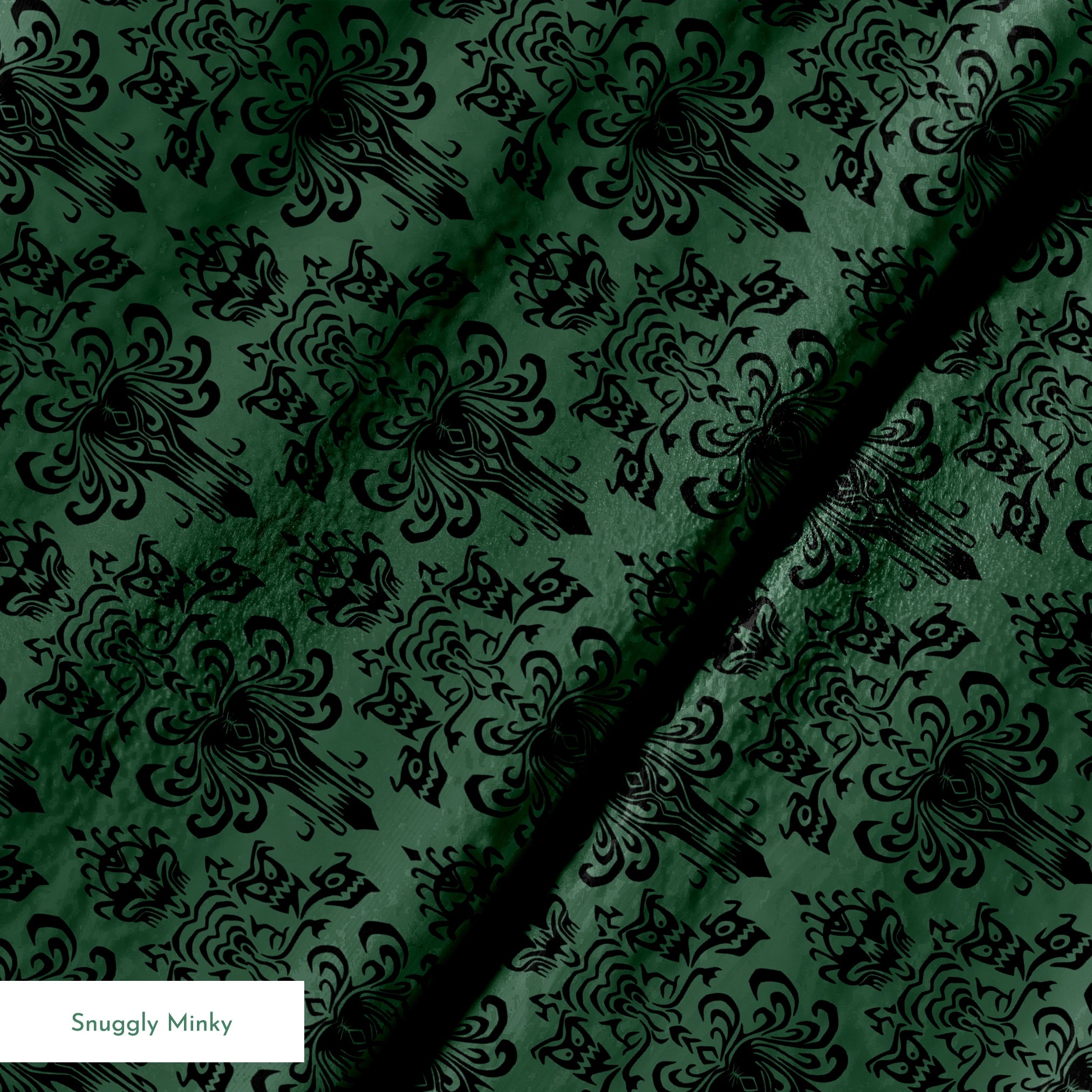 The image shows an elegant Victorian or Gothic-style damask pattern in black against a dark green background. The repeating ornate design features intricate scrollwork, flourishes, and symmetrical decorative elements arranged in a traditional wallpaper or textile pattern style. springs minky texture