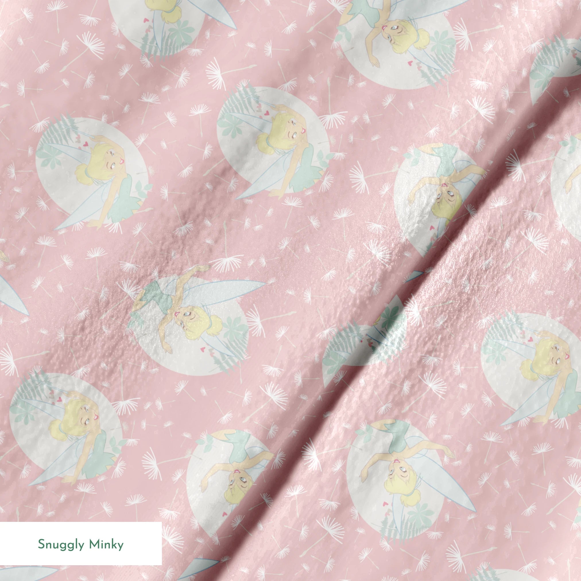 Pink background with dandelion seed pattern featuring Tinker Bell in mint green circles, whimsical Disney design springs minky texture