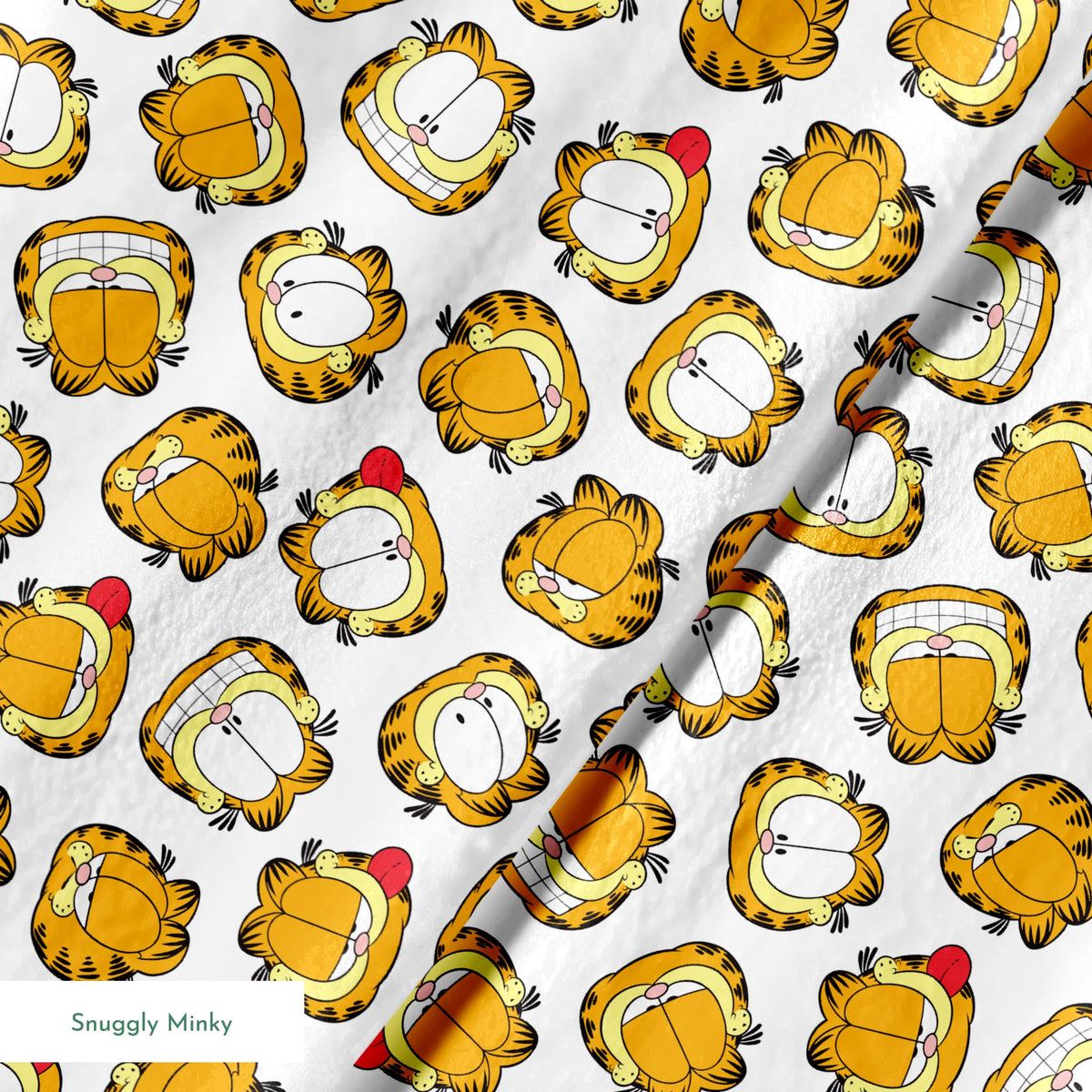 Pattern of cartoon cat faces with orange and yellow coloring against white background springs minky texture