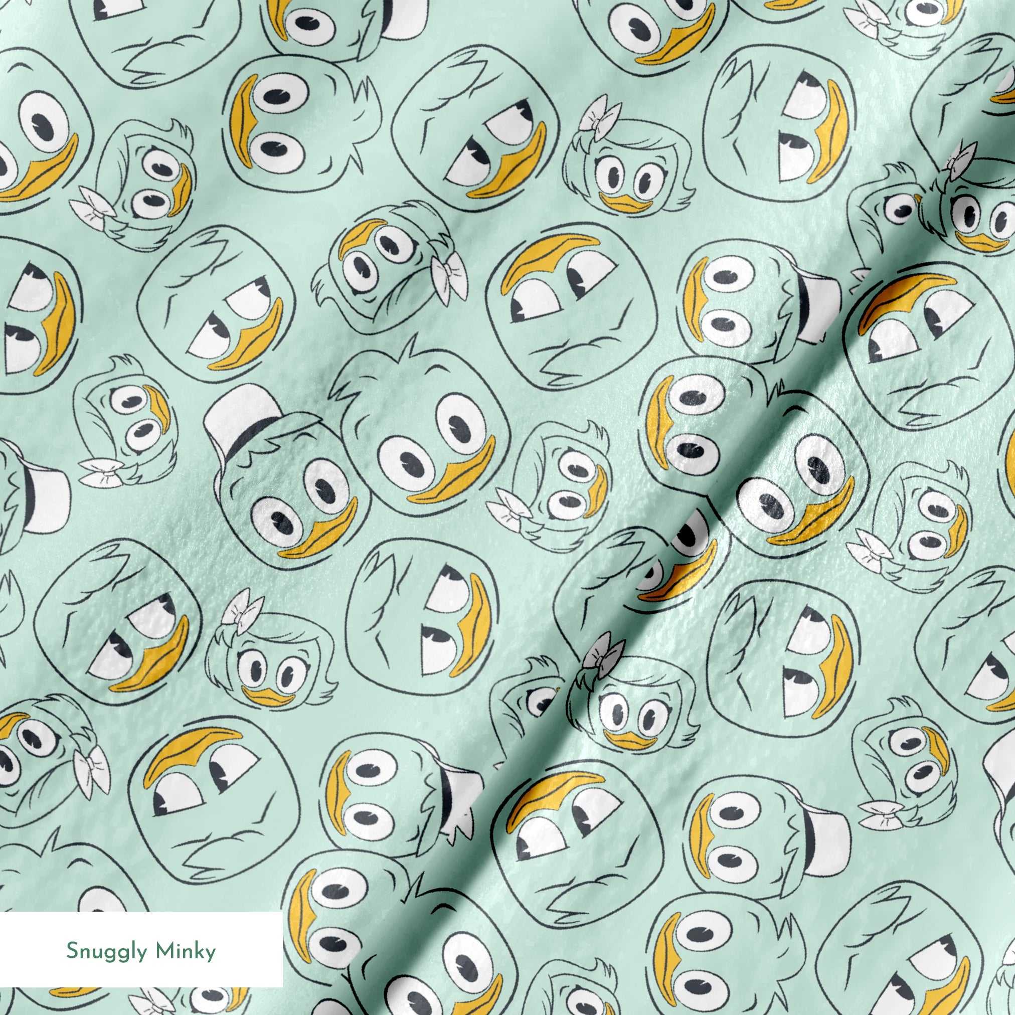 Disney Duck Tales Character Faces on Mint Fabric