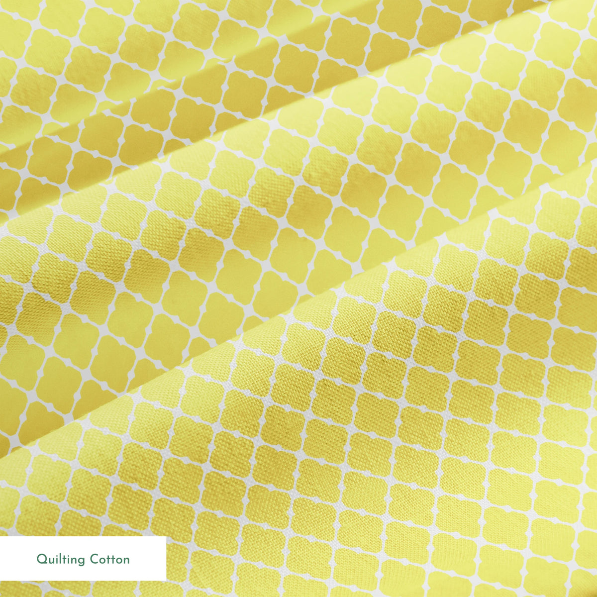 Yellow quatrefoil pattern on white background with Moroccan tile inspired design springs quiltingcotton texture