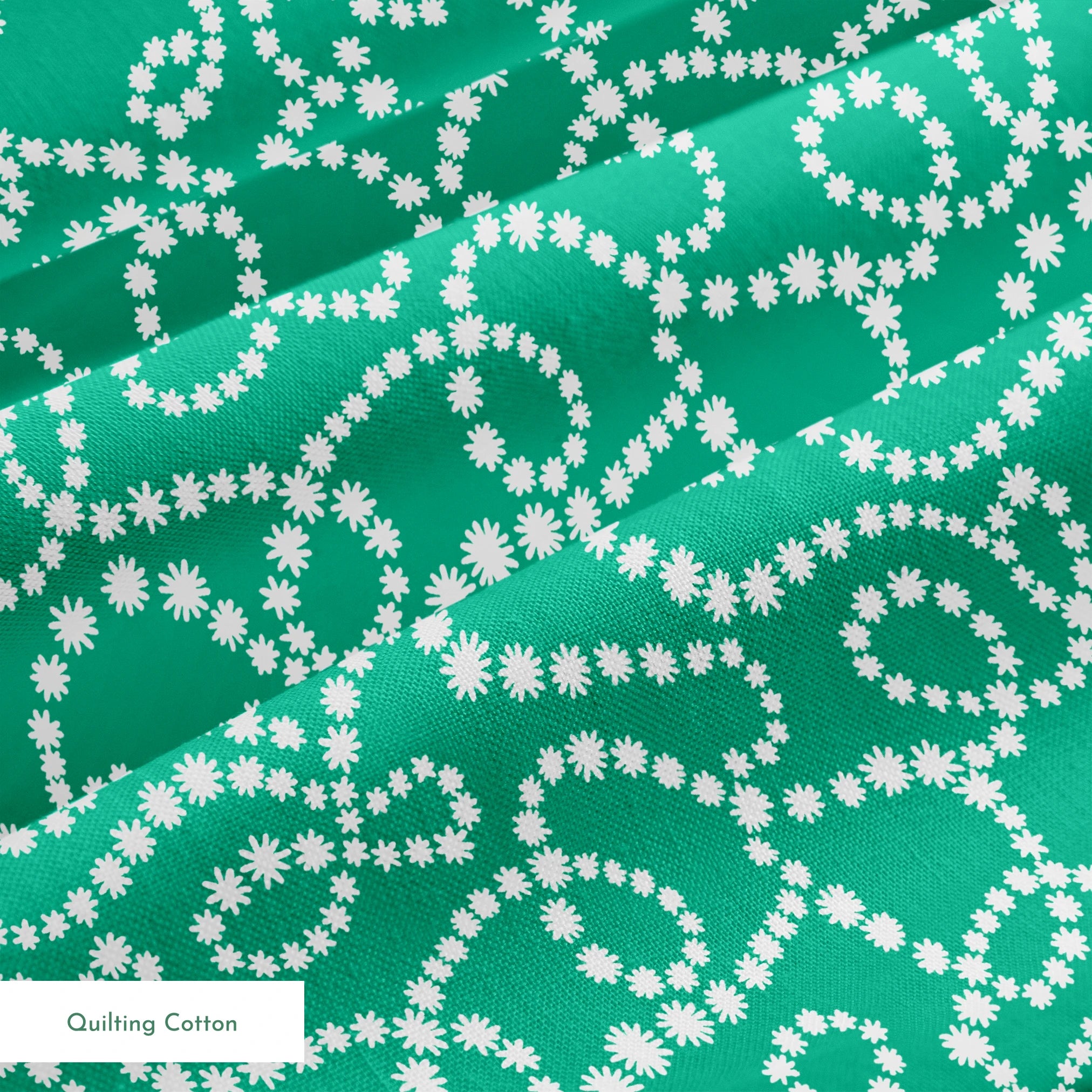White dotted swirling patterns on green background forming abstract curving lines springs quiltingcotton texture