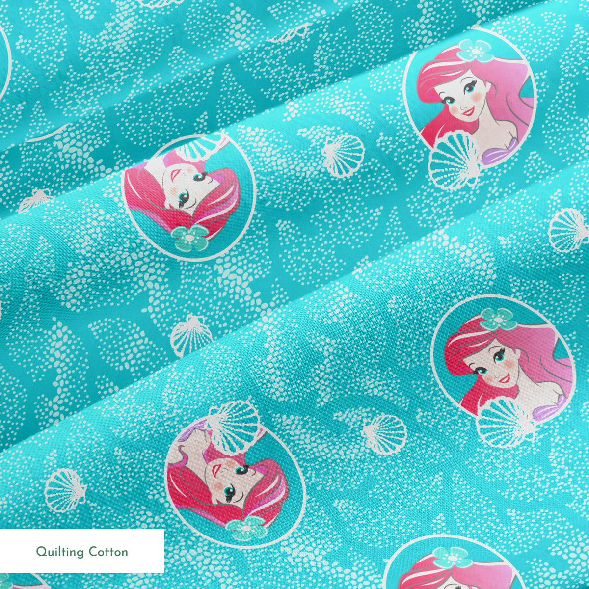 The Little Mermaid pattern with Ariel in turquoise circles on aqua background with seashells springs quiltingcotton texture