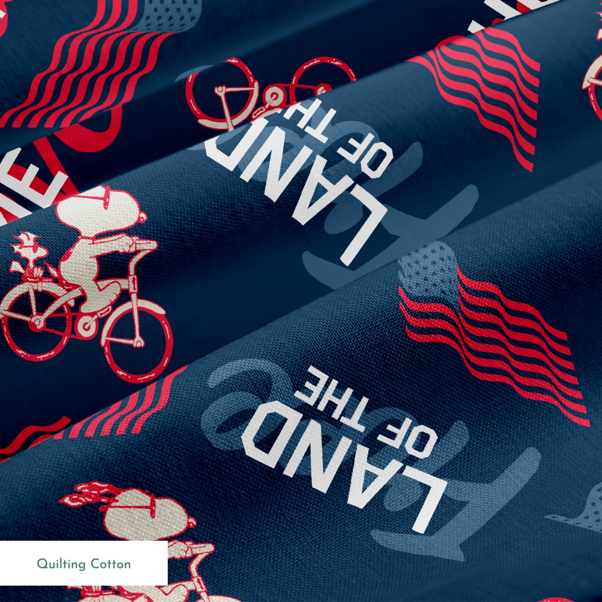Repeating Peanuts "Home of the Brave" text pattern with bicycles on navy blue background with red wavy lines springs quiltingcotton texture
