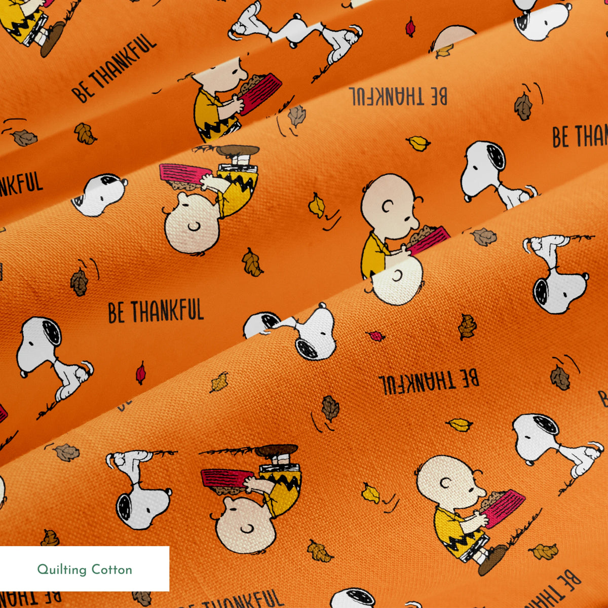 Peanuts characters on orange background with autumn leaves and "Be Thankful" text pattern springs quiltingcotton texture
