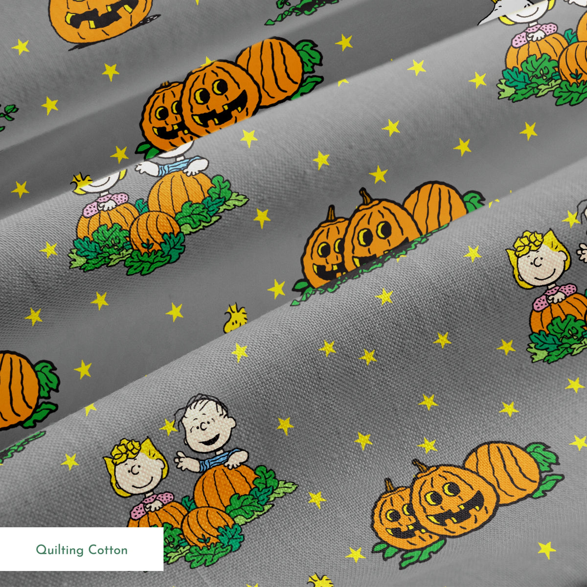 Peanuts Halloween pattern with Snoopy on pumpkins, Peanuts characters in pumpkin patches, and yellow stars on gray background. springs quiltingcotton texture