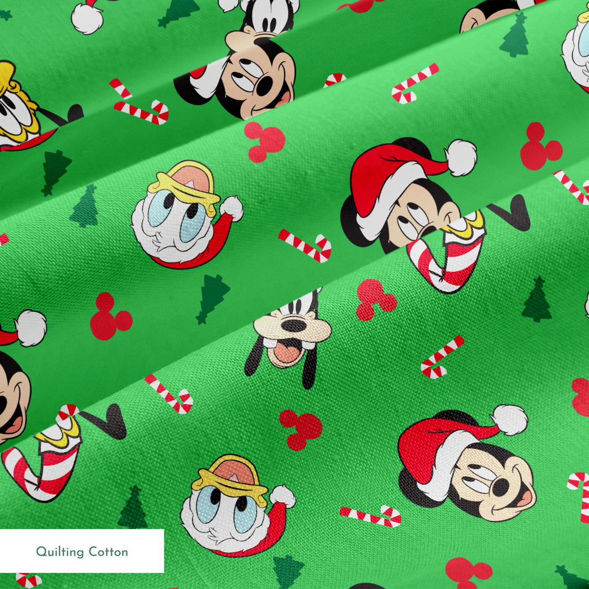 Disney Mickey Mouse characters in Santa hats on green background with candy canes and Christmas trees springs quiltingcotton texture