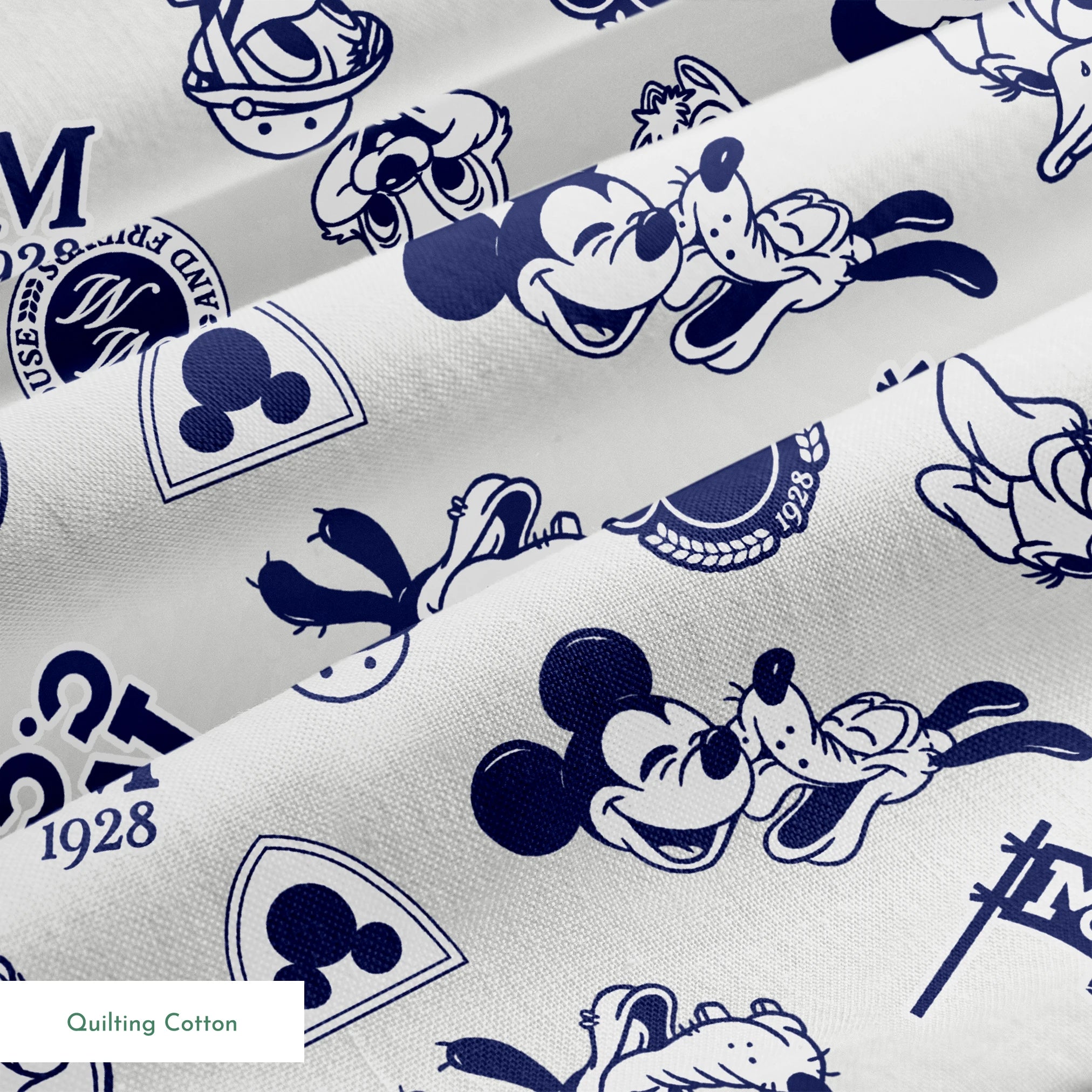Disney character pattern with Mickey Mouse, Donald Duck and other classic cartoon figures in navy blue on light background. springs quiltingcotton texture
